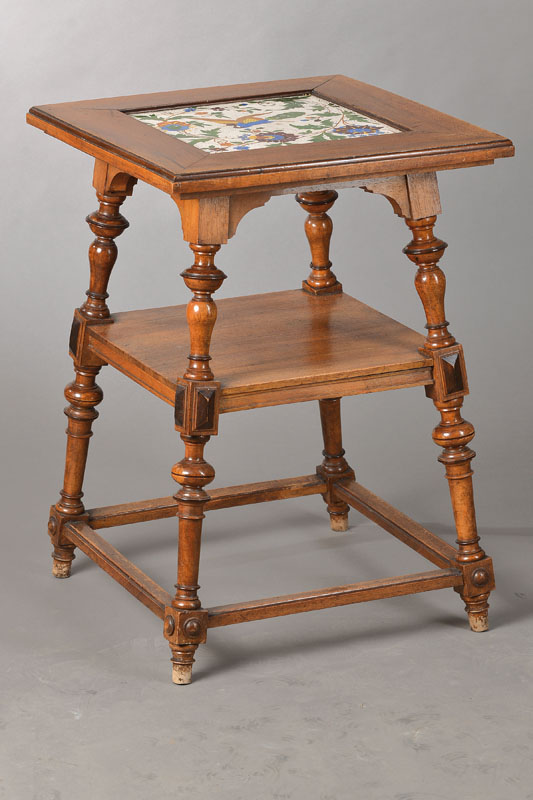 Blumentischchen, deutsch, um 1880, Nussbaum mass., obere Platte mit Jugendstilfliese, reiche Drechselarbeit, ca. 70x50x50 cm