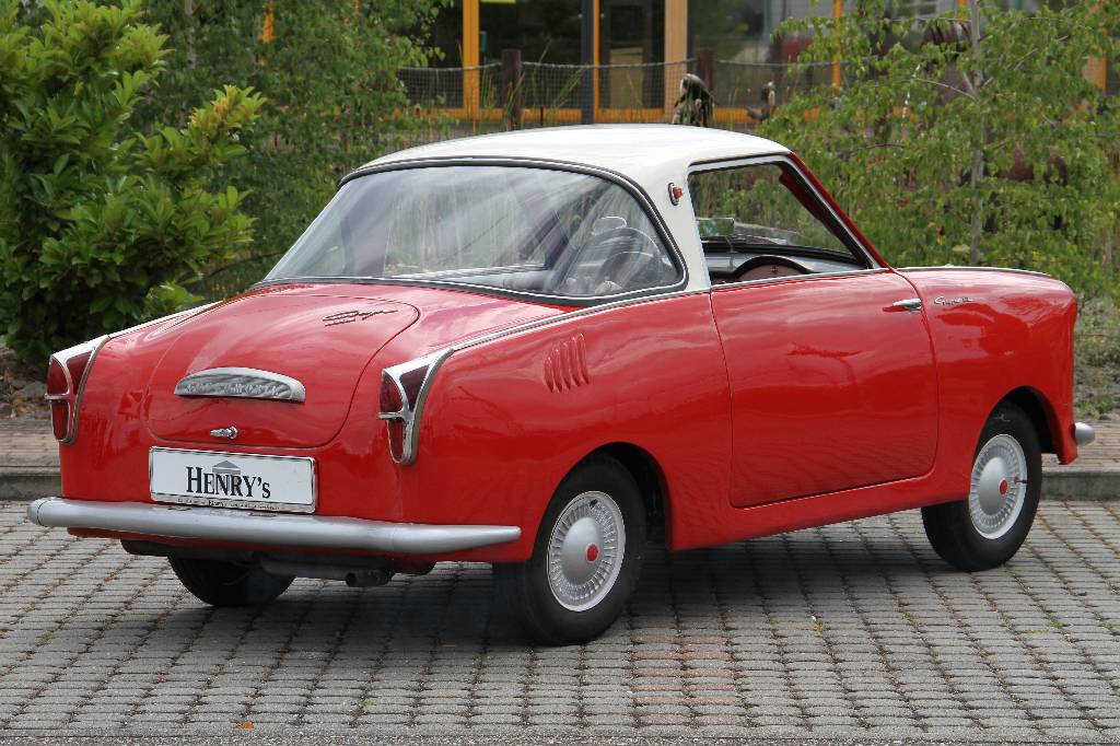 Detail b: Goggomobil T250 Coupe, EZ 03.1959, Laufleistung 91.365 km abgelesen, H-Zulassung,10 KW/ 13,6 PS, Schaltgetriebe, rot mit weißemDach, Kunstleder rot, ...
