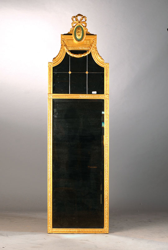 Prunkspiegel im Louis-Seize-Stil, um 1870/80, Holz verstuckt u. goldfarben gefasst, hochrechteckig, Spiegelglas facettiert u. z. T. gegliedert, ...