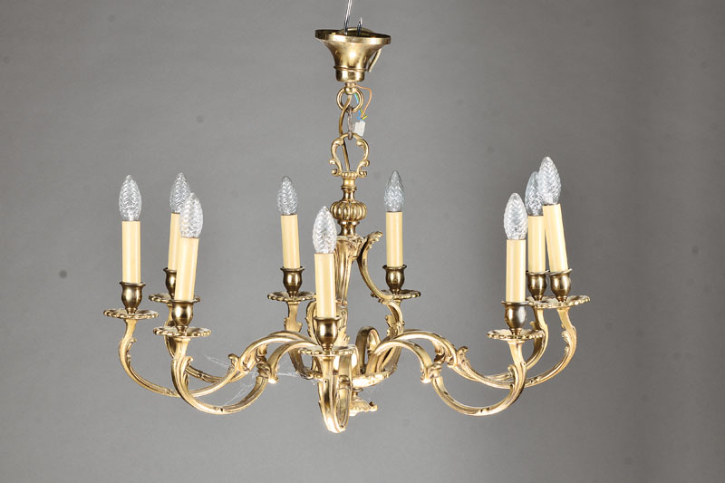 Bronzelüster, deutsch, um 1960/70, Bronzeguß massiv, im Rokoko-Stil, 9 geschwungene Ausleger mit je einer Brennstelle, sparsame ...
