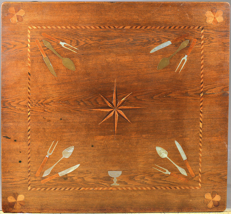 Detail a: Tisch im Barockstil, um 1880, Eiche massiv, ausgefallene Zinn- u. Messingeinlagen in Form von Besteck, mittiger Faltstern, wuchtige Säulenbeine ...