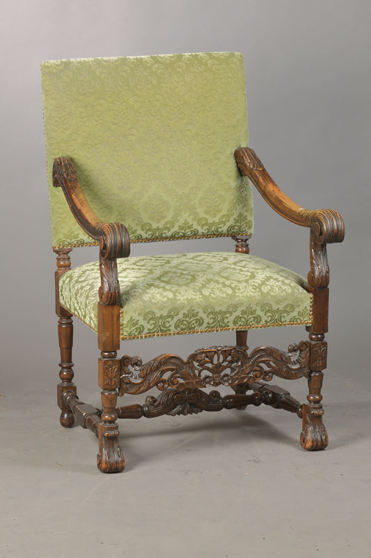 Stuhlsessel, deutsch, um 1880/90, im Frühbarock-Stil, Nussbaum massiv, Handläufe in Akanthusblattform, reich halbplastisch geschnitzter Mittelsteg, ...
