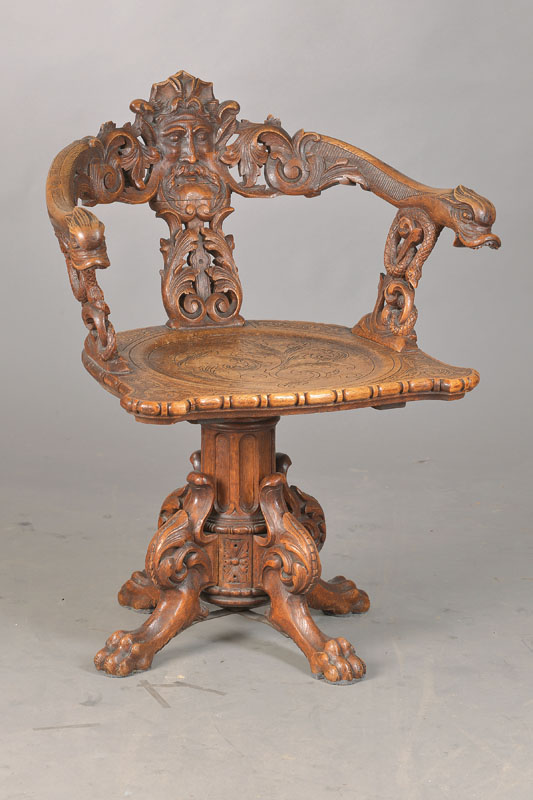 Schreibtischstuhl, deutsch, um 1870/80, Nussbaum und Eiche, im Neo-Renaissance-Stil, überreich geschnitzt, Handläufe als Delphine und Rückenbrett ...
