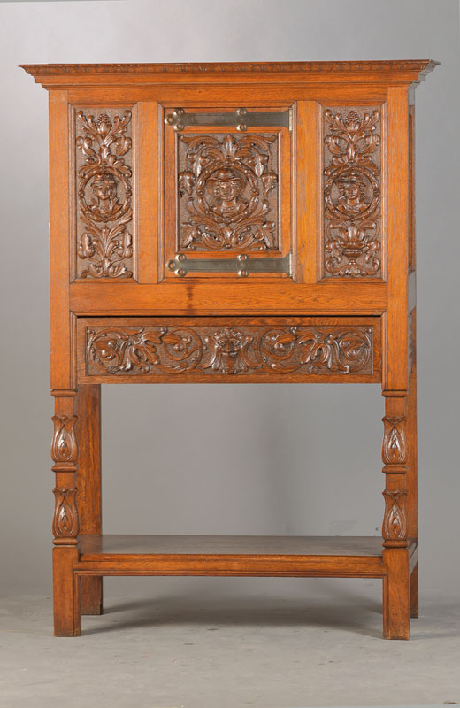 Stollenschrank, deutsch, um 1880, Eiche massiv, 1-türig u. 1-schübig, Stollenbau mit unterer Ablage, halbplastische Portraits u. Fratzen sowie ...