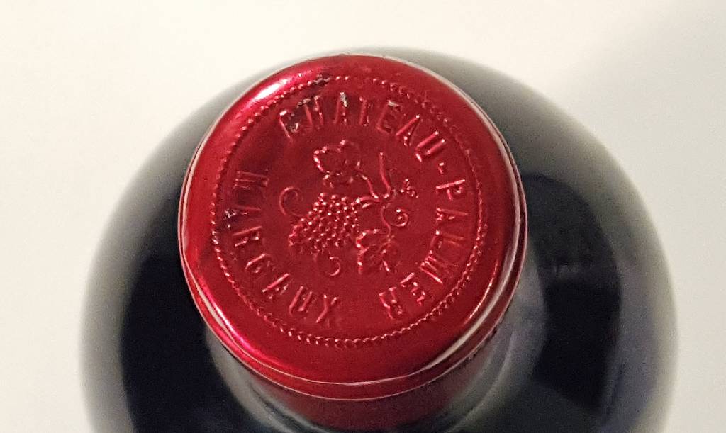 Detail a: 1 Flasche Chateau Palmer, Margaux, ca. 75 cl, Füllstand: ca. into neck, unverkostet, ohne Etikett, Chateau auf Kapsel ersichtlich, wahrscheinlich ...