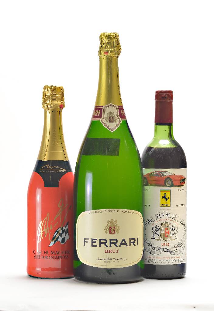 3 Flaschen Ferrari Sekt und Wein, 1 x 1979 Chateau Fourcas Hosten, Listrac-Medoc, Nummer 1368, Etikett mit einem Ferrari Gto, 1x 1989 Boccatura ...