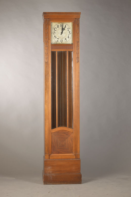 Standuhr, Leonhard Furtwängler & Söhne, 20/25er Jahre, Nussbaum/furnier (Furnierteile im sockelbereich fehlen), Schnitzarbeiten, facett. verglast, ...