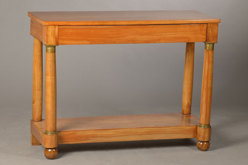 Biedermeierkonsole, deutsch, um 1830, Kirschbaum, Platte ergänzt, mit Zargenschublade, geprägte Messingkapitelle u. -basen, ca. 81x107x39 cm