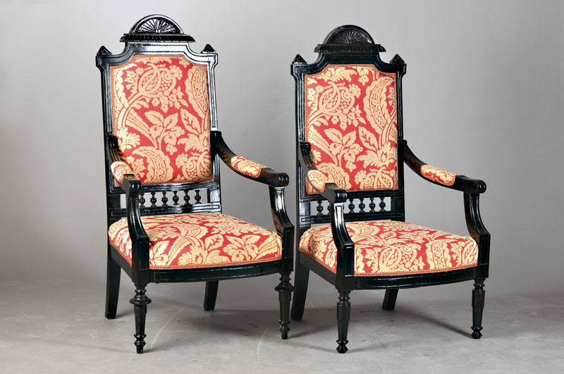 Paar Kaminsessel / Armlehnsessel, deutsch, um 1880/90, Weichholz, später schwarz gefaßt, stilübliche Ornamentik, H. ca. 177 cm, Sh. ca.44 cm