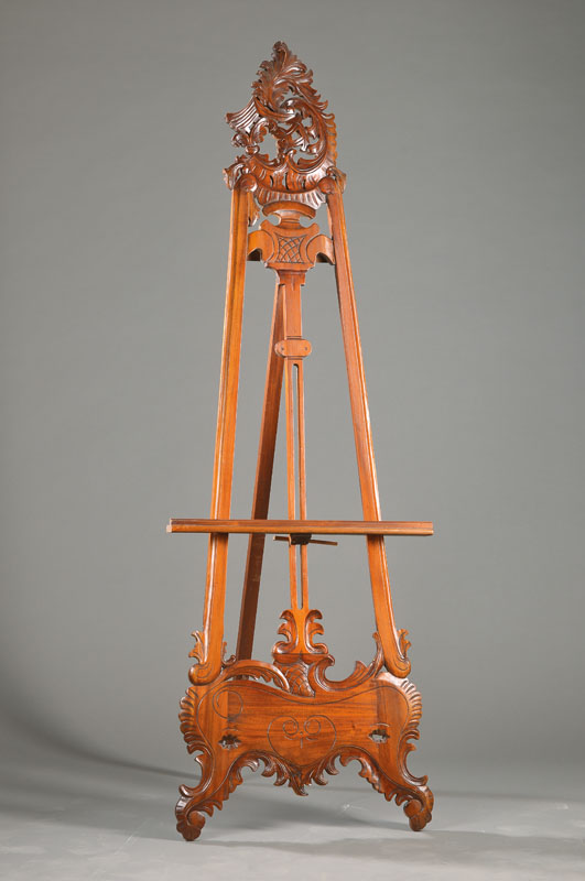 Staffelei, 1.H.20.Jh., Mahagoni massiv, im üppigem asymmetrischem Rokoko-Stil mit Rocaillen-Ornamentik, Querholz höhenverstellbar, Gesamthöhe ca. ...