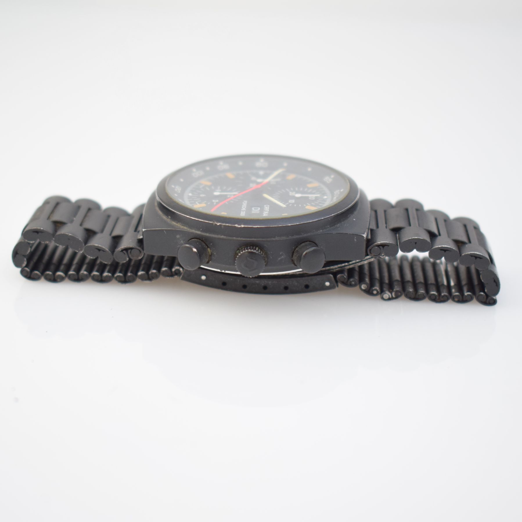 Detail e: ORFINA/PORSCHE DESIGN Herrenarmbanduhr mit Chronograph, Schweiz um 1980, Automatik, geschwärztes Edelstahlgeh. mit orig. Gliederband, Boden geschr., ...