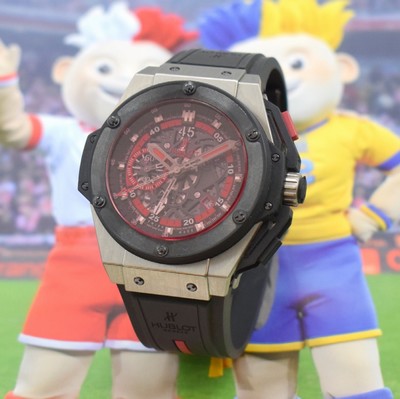Image HUBLOT Big Bang King Power limited gents wristwatch "UEFA Euro 2012 Poland - Ukraine" with chronograph reference 716.NM.1129.RX.EUR12, self winding, limited edition of 500 pieces world wide, on both sides glazed case in titanium/rubber, glazed back 8-times screwed down, skeletonised dial with applied hour-indices, date, original rubber strap with deployant clasp, diameter approx. 48 mm, length approx. 22 cm, original box & papers, condition 2