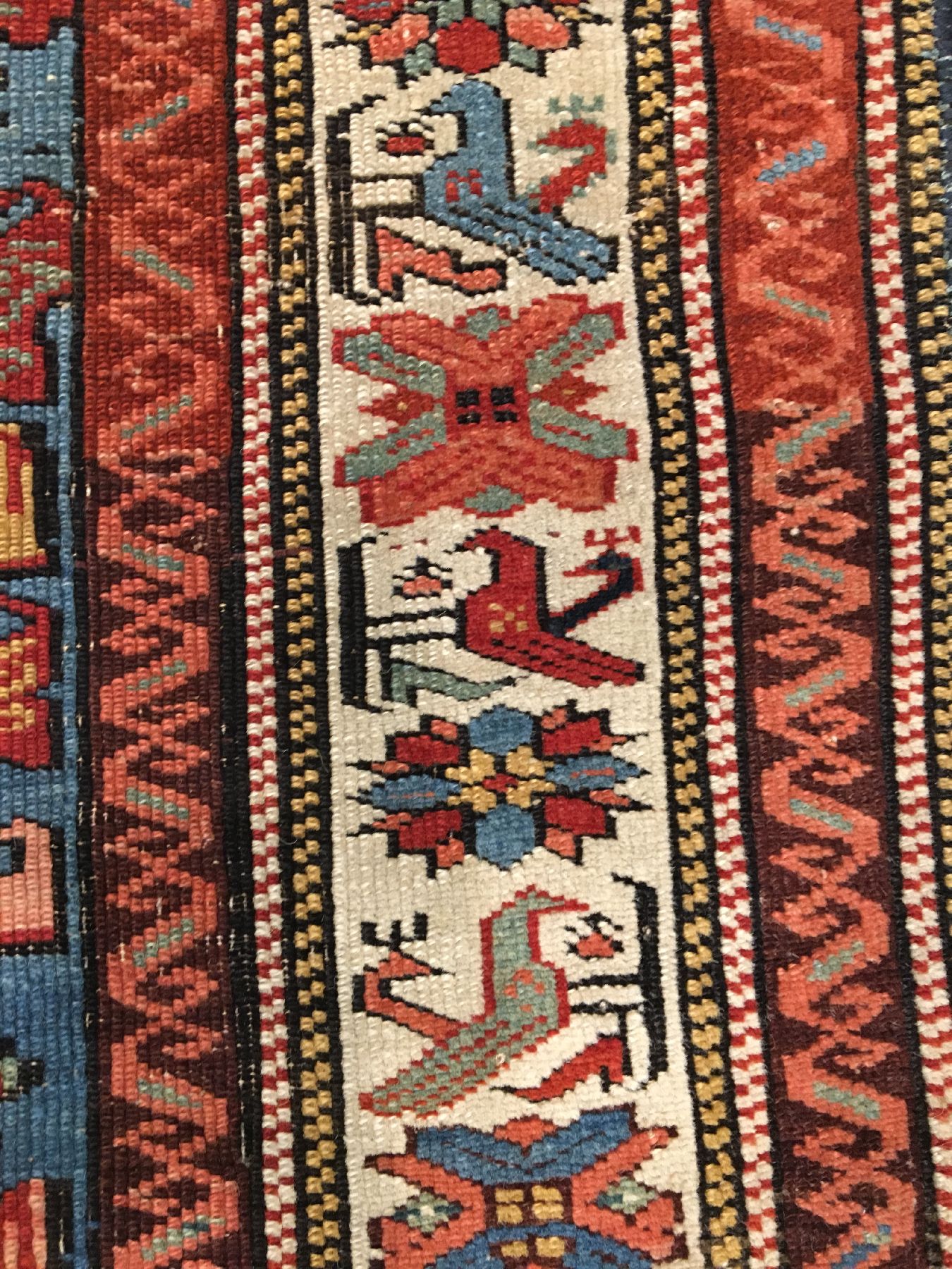 Detail e: Seichur antik, Ostkaukasus Kuba-Gebiet, Ende 19.Jhd., Wolle geknüpft auf Wolle. Kleinformatiger Seichur im Nelkentypus auf himmelblauen Grund. ...