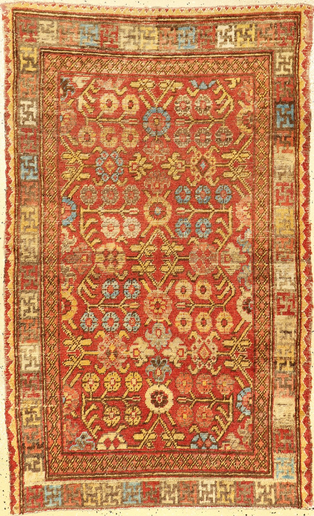 Khotan antik, Ostturkestan, Mitte 19.Jhd., Wolle geknüpft auf Baumwolle. Seltener kleinformatiger Khotan mit charakteristischen Blüten allover ...