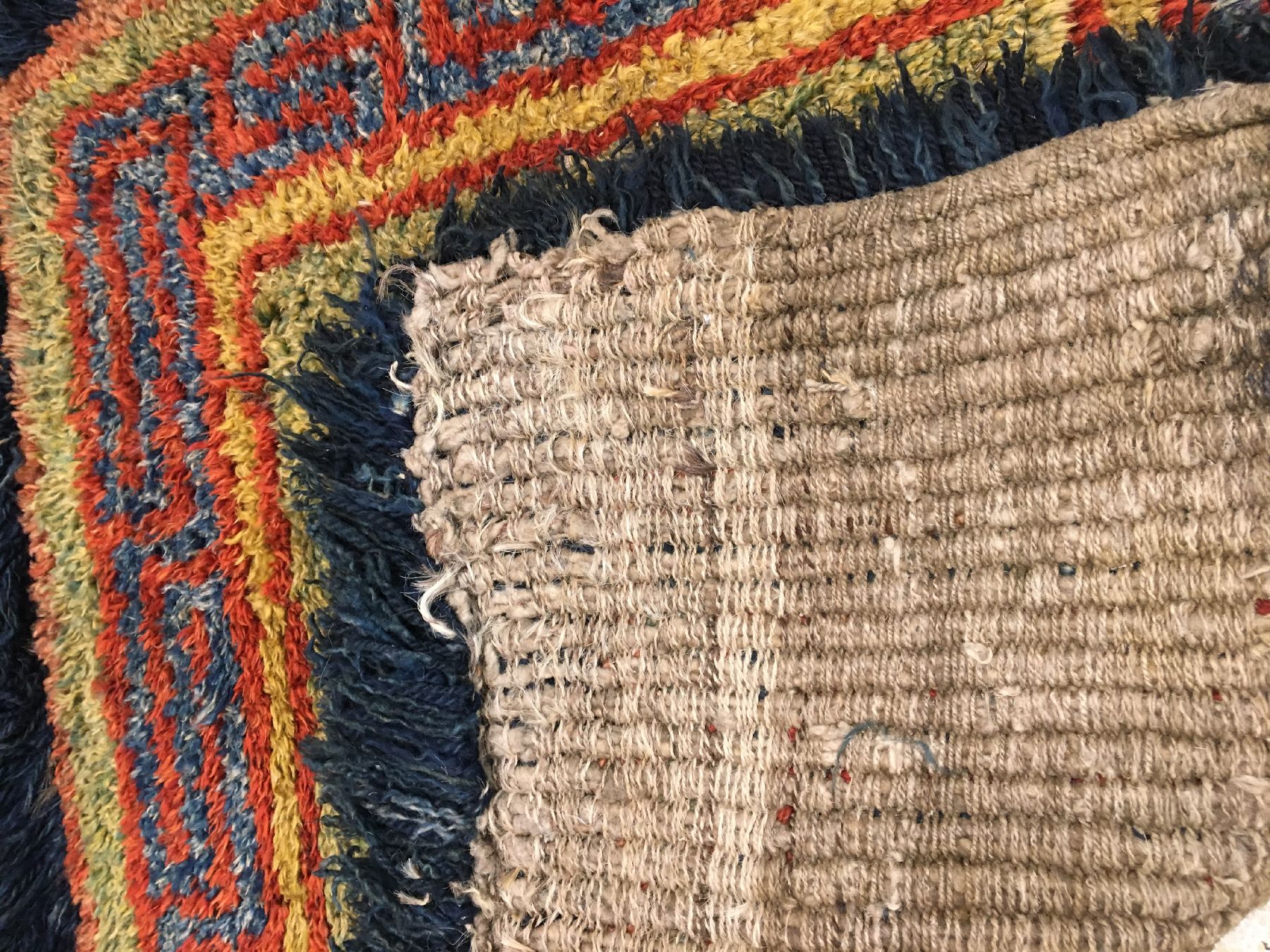 Detail g: Wangden Drumtze "Meditations-Teppich" antik, Tibet, 19.Jhd., Wolle geknüpft auf Wolle. Tibetisches Glückssymbol auf grünen Grund mit ...