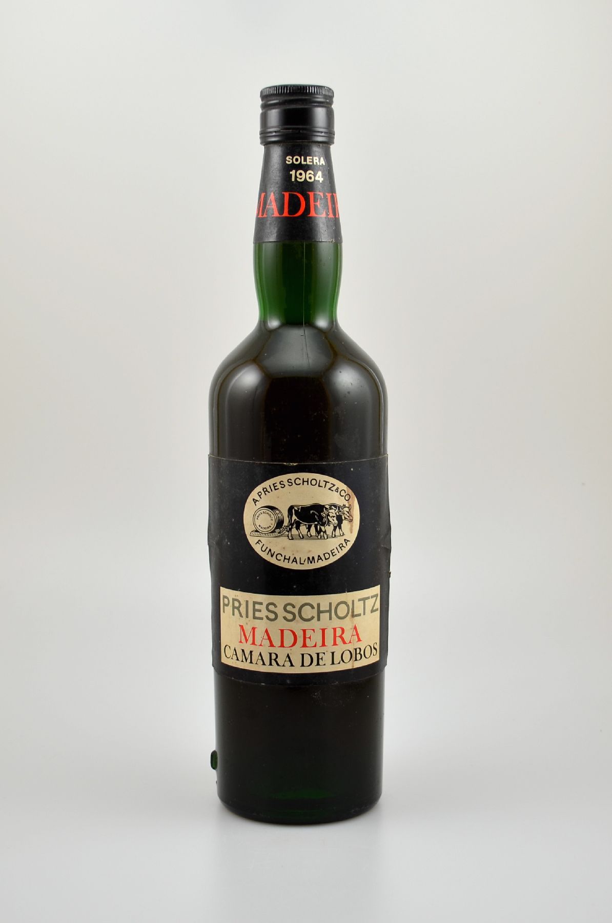 1 Flasche 1964 Madeira Solera, A. Pries Scholtz Madeira Camara de Lobos, importiert durch Bols-Import Neuss/Rh, Etikett l. besch., bzw., beschmutzt, ...