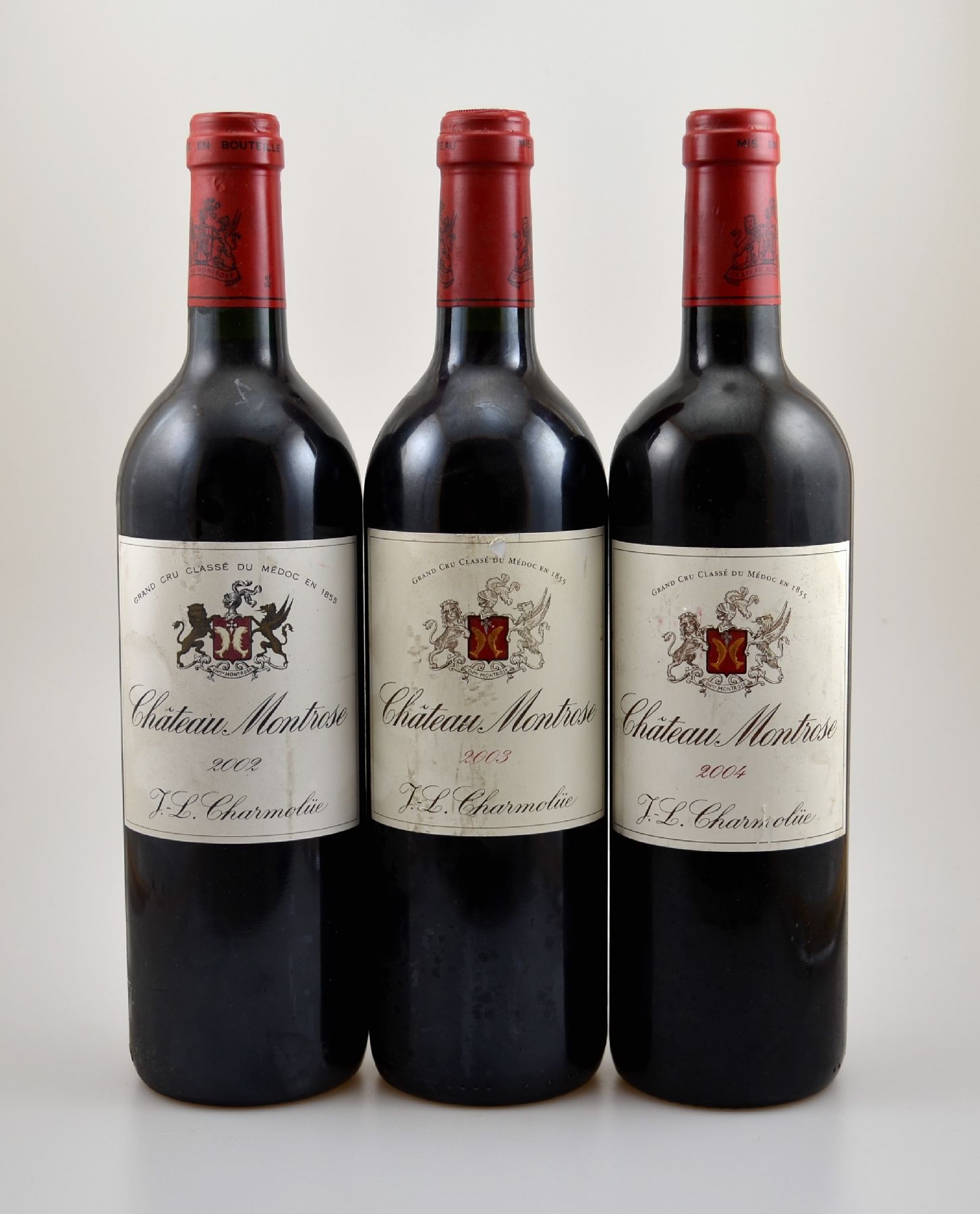 3 Flaschen Chateau Montrose, Jahrgänge: 2002, 2003 und 2004, Saint-Estephe, Grand Cru Classe, je ca. 75 cl, 13 % Vol., Füllstände: je into neck, ...