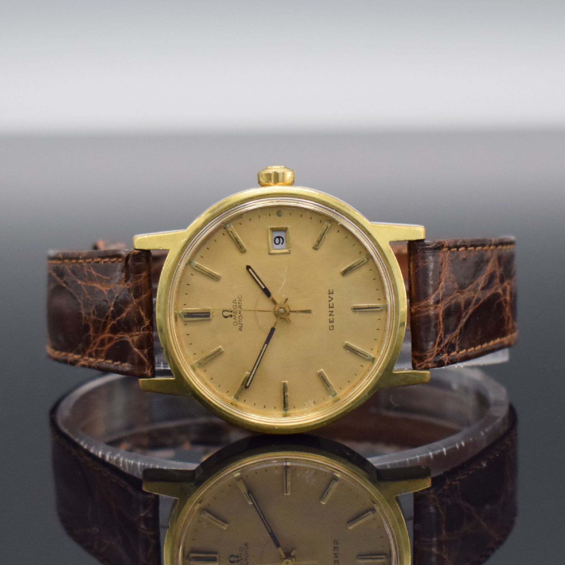 OMEGA Geneve Herrenarmbanduhr, Schweiz um 1973, Automatik, Ref. 1660098, verg. Gehäuse, Edelstahlboden geschr., orig. Lederband m. orig. Dornschl., ...