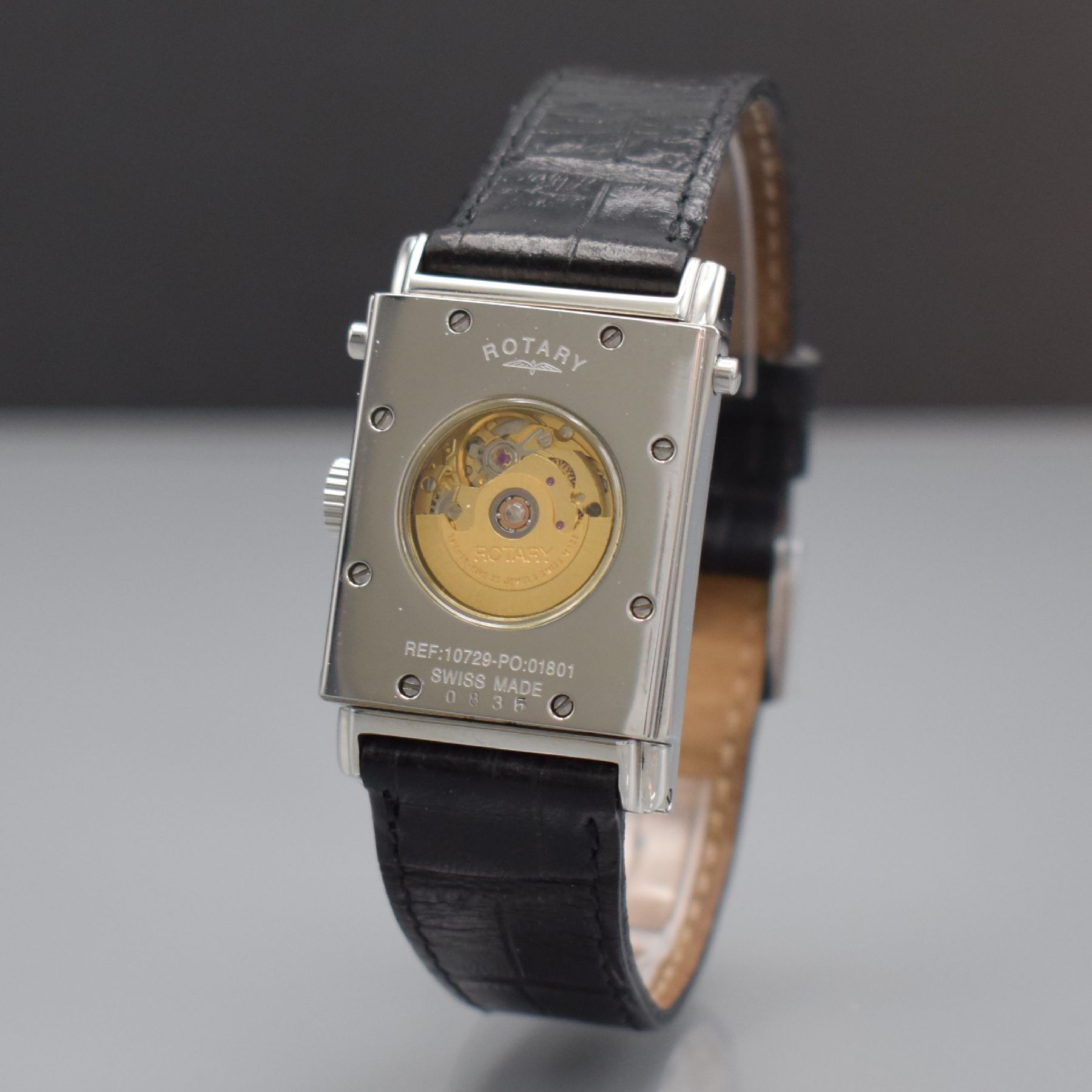 Detail d: ROTARY rechteckige drehbare Herrenarmbanduhr in Stahl, Schweiz um 2001, Automatik, beids. vergl. Wendegeh., Boden 8-fach verschr., silb. Zifferbl. m. ...