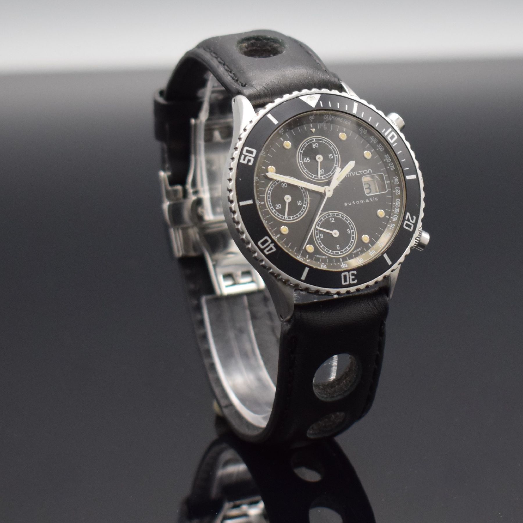 Detail d: HAMILTON HTC Herrenarmbanduhr mit Chronograph, Schweiz um 1985, Automatik, Edelstahlgeh., Boden geschr., eins. drehb. Lünette mit 60- Teilung, ...