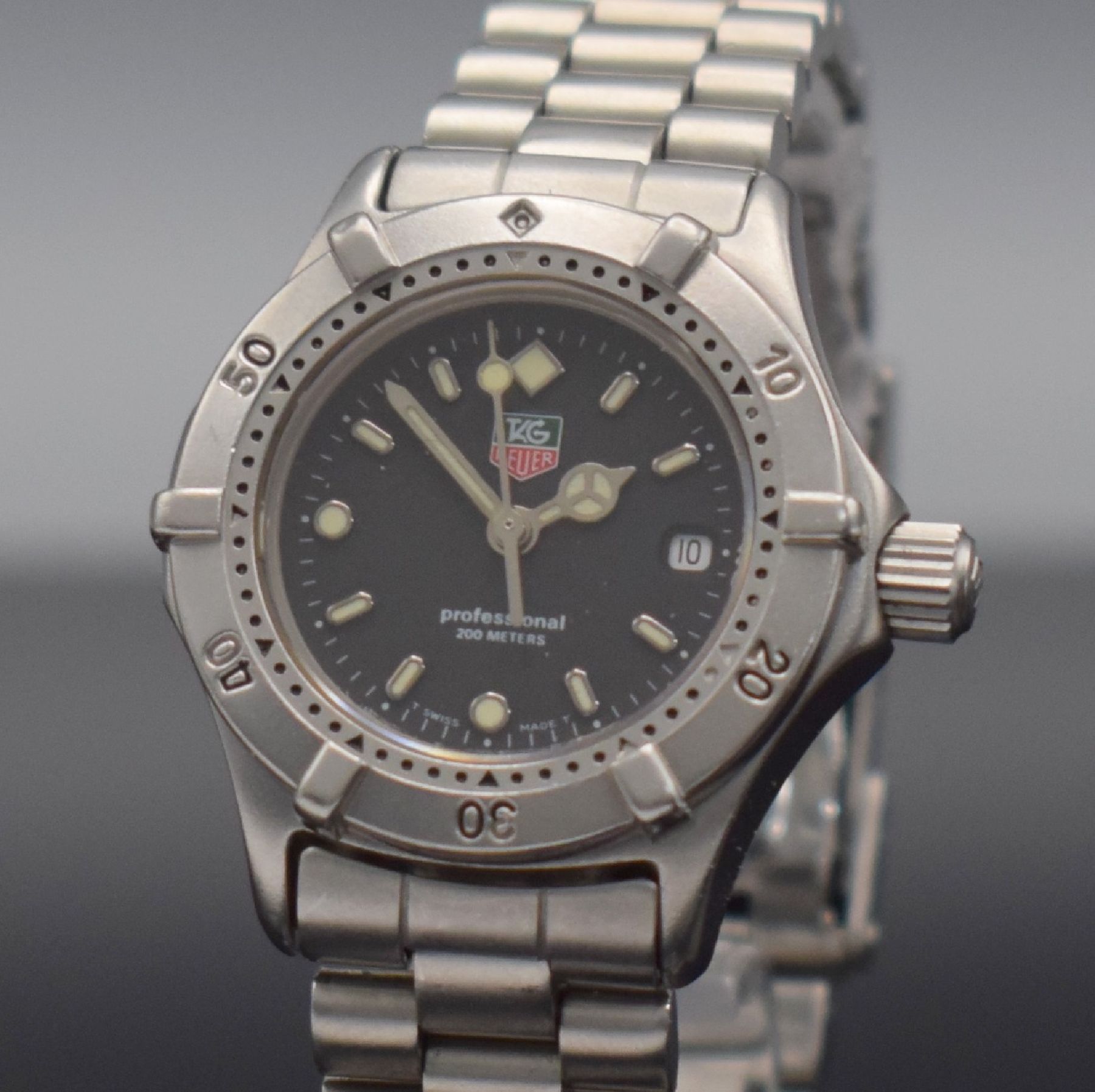 Detail c: TAG HEUER Professional Damenarmbanduhr, Schweiz um 1990, quarz, Ref. WE-1410-R, verschr. Edelstahlgeh., eins. drehb. Lünette, schwarzes Zifferbl. m. ...