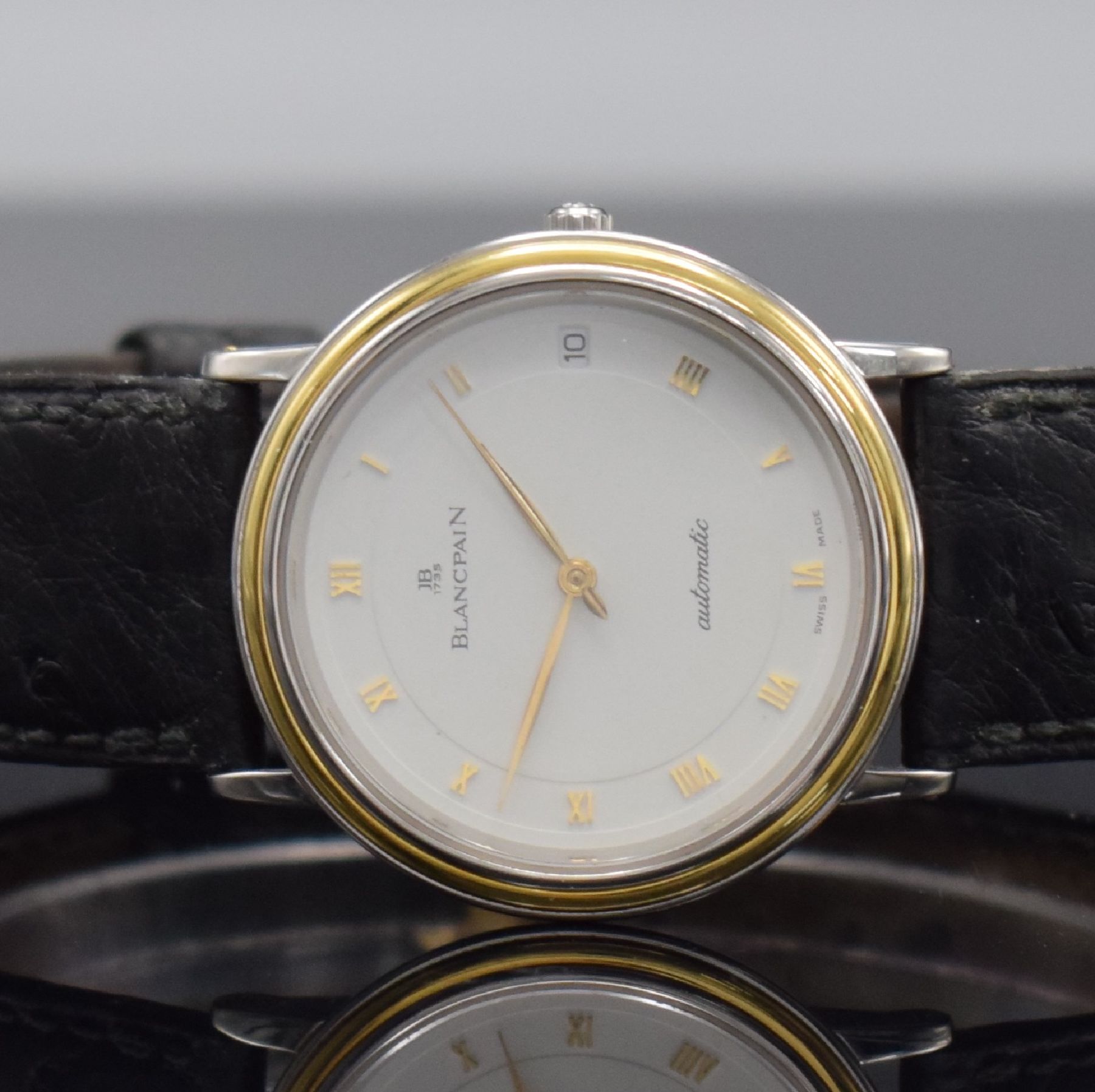 Detail a: BLANCPAIN feine Herrenarmbanduhr, Automatik, Schweiz um 1990, flaches Edelstahlgeh. inkl. Lederband m. orig. Dornschl., Lünette in GG, Boden & ...