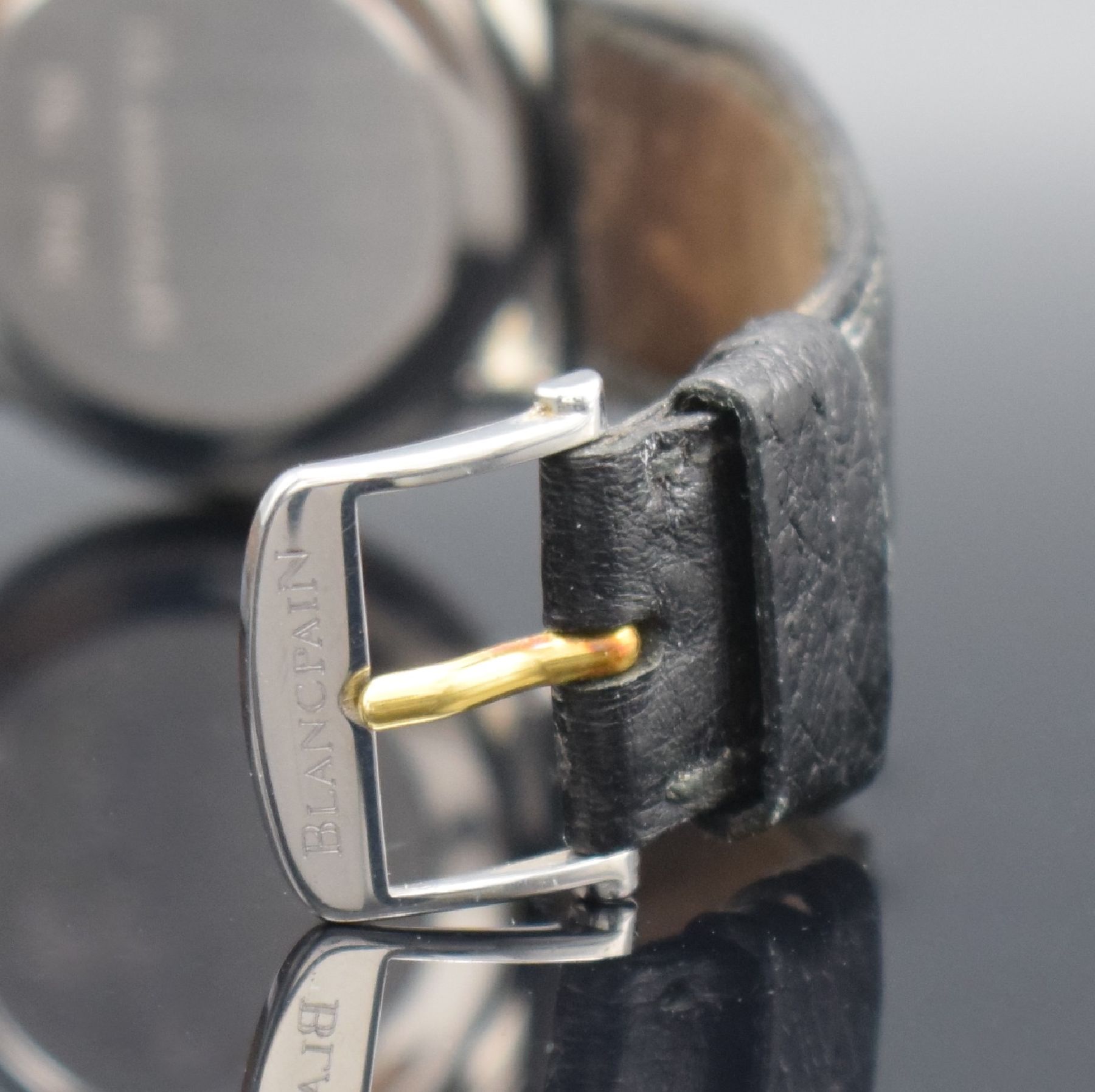 Detail d: BLANCPAIN feine Herrenarmbanduhr, Automatik, Schweiz um 1990, flaches Edelstahlgeh. inkl. Lederband m. orig. Dornschl., Lünette in GG, Boden & ...