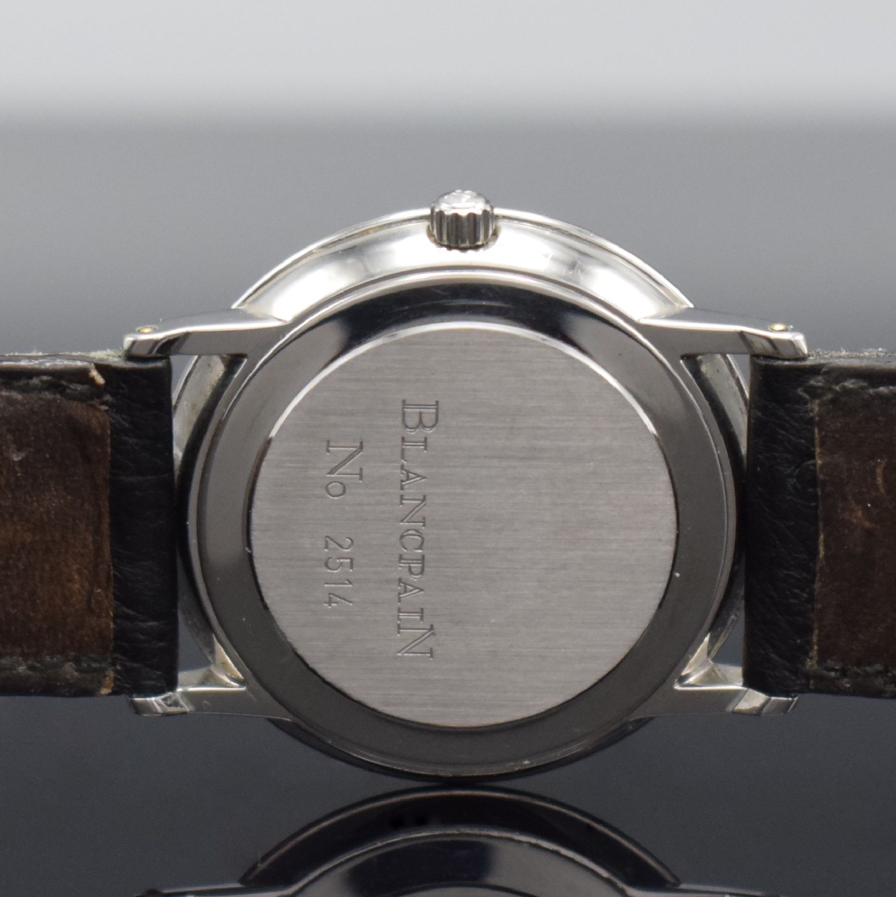 Detail f: BLANCPAIN feine Herrenarmbanduhr, Automatik, Schweiz um 1990, flaches Edelstahlgeh. inkl. Lederband m. orig. Dornschl., Lünette in GG, Boden & ...