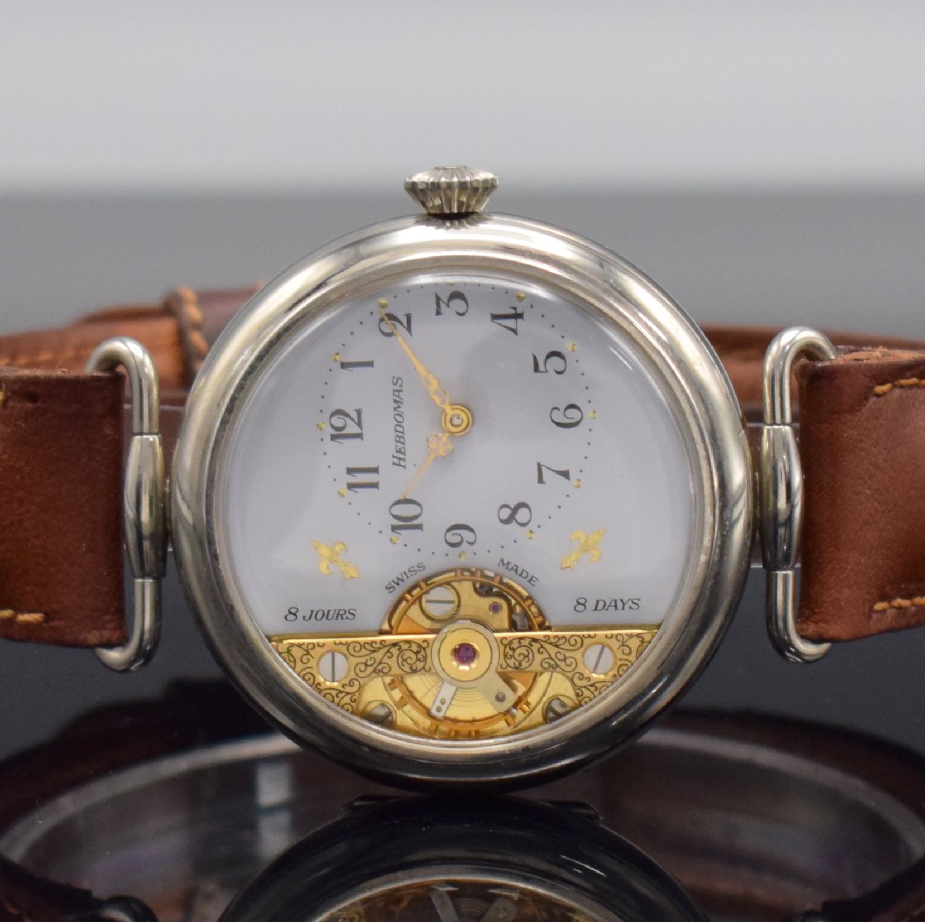 Detail a: HEBDOMAS große 8-Tage Armbanduhr, Schweiz um 1990, Handaufzug, glatt. Nickel- Scharniergeh., bewegl. Anstöße, weißes 3/4- Zifferbl., sichtbare ...
