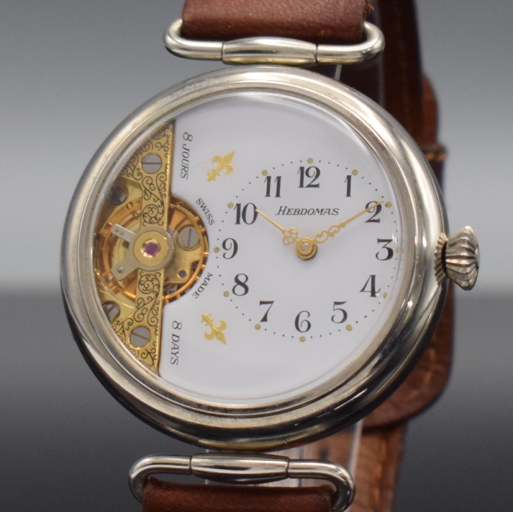 Detail c: HEBDOMAS große 8-Tage Armbanduhr, Schweiz um 1990, Handaufzug, glatt. Nickel- Scharniergeh., bewegl. Anstöße, weißes 3/4- Zifferbl., sichtbare ...