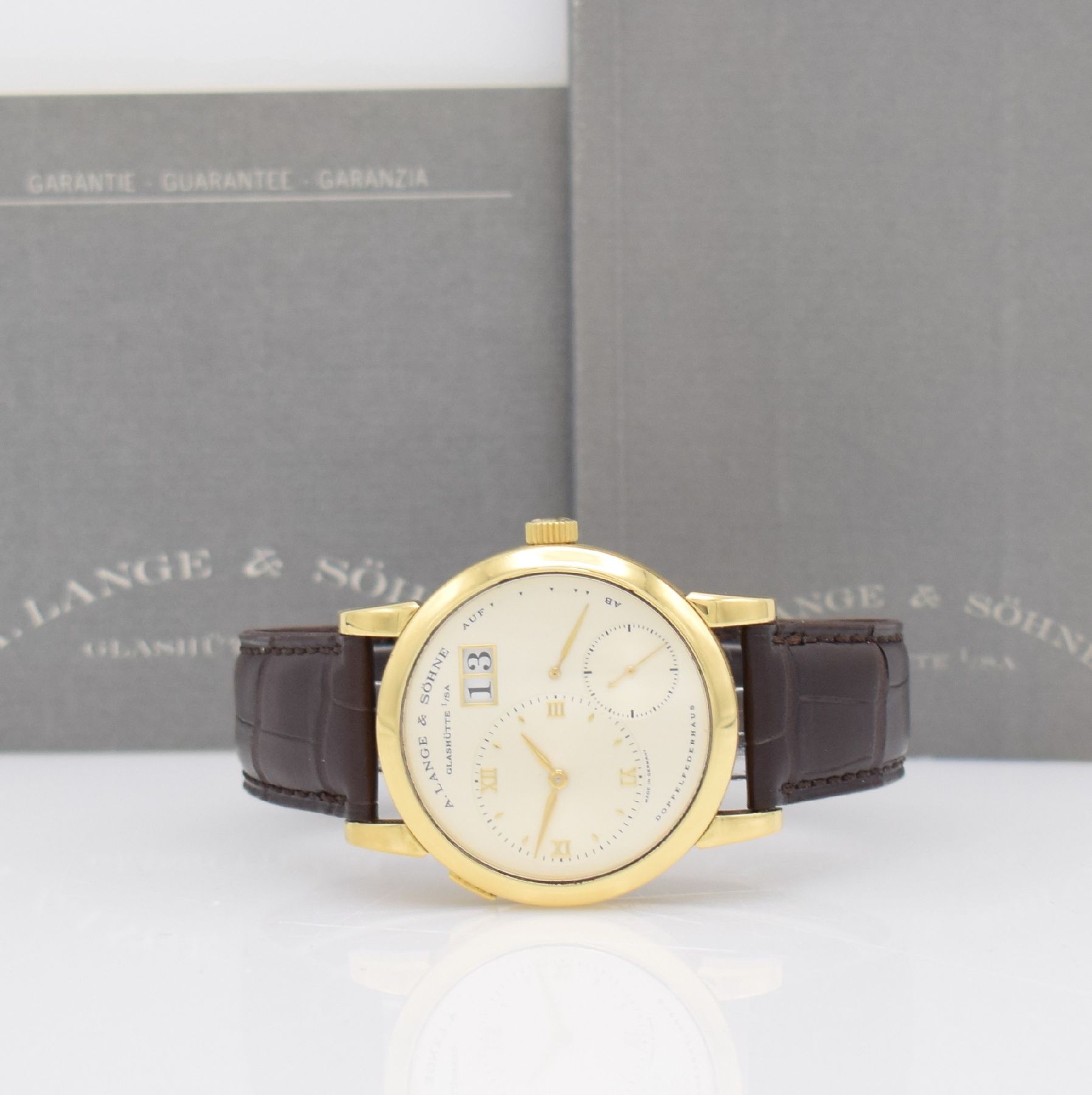 A. LANGE & SÖHNE seltene Lange 1 Herrenarmbanduhr in GG 750/000 mit Goldboden aus der ersten Serie, Handaufzug, Ref. 101.001, Boden 6-fach verschr., ...