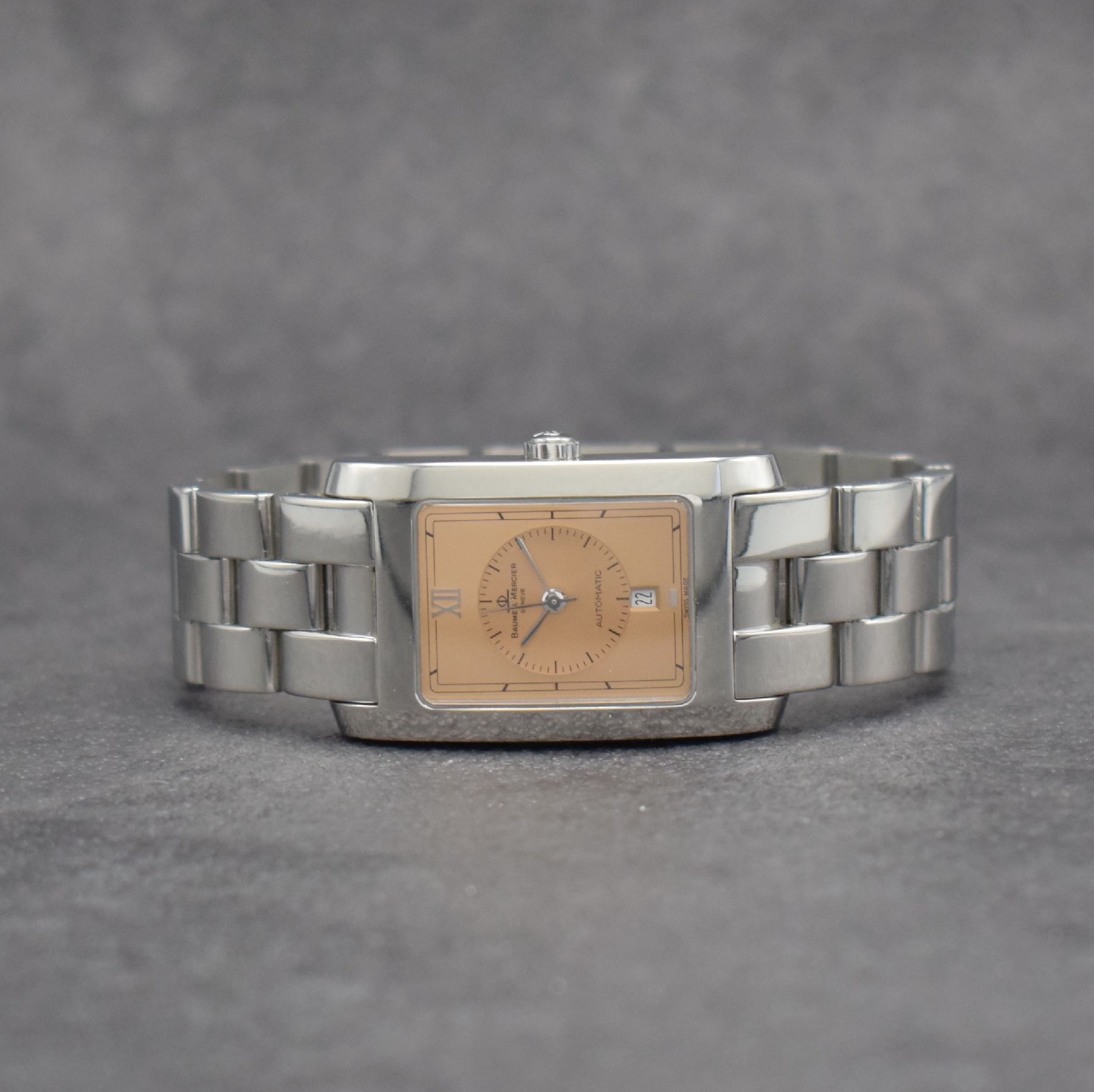 BAUME MERCIER Hampton Armbanduhr in Edelstahl, Schweiz um 1996, Automatik, rechteckiges Geh., Boden aufgedr., Gliederband m. Faltschl., kupferfarb. ...