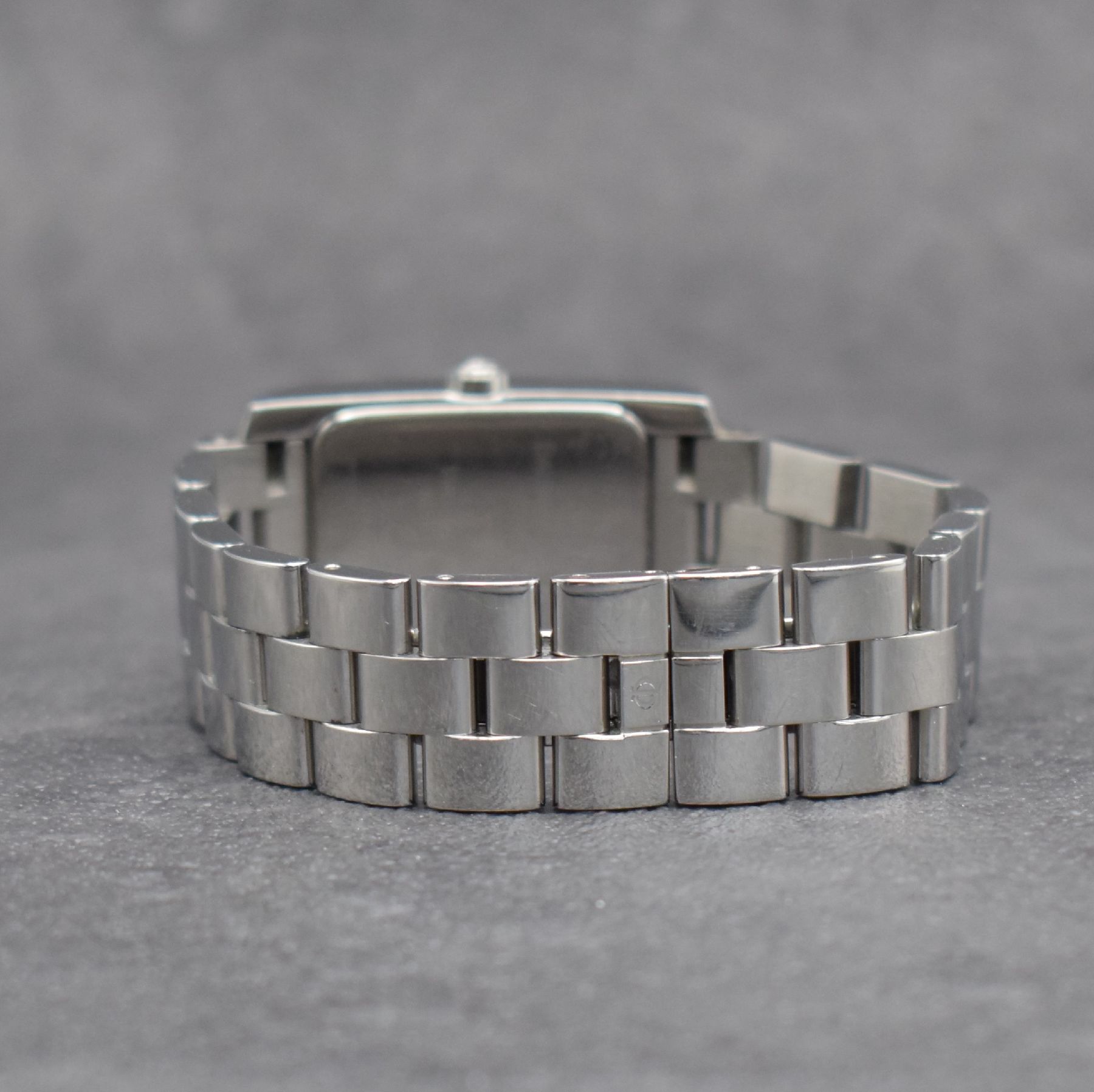 Detail d: BAUME MERCIER Hampton Armbanduhr in Edelstahl, Schweiz um 1996, Automatik, rechteckiges Geh., Boden aufgedr., Gliederband m. Faltschl., kupferfarb. ...