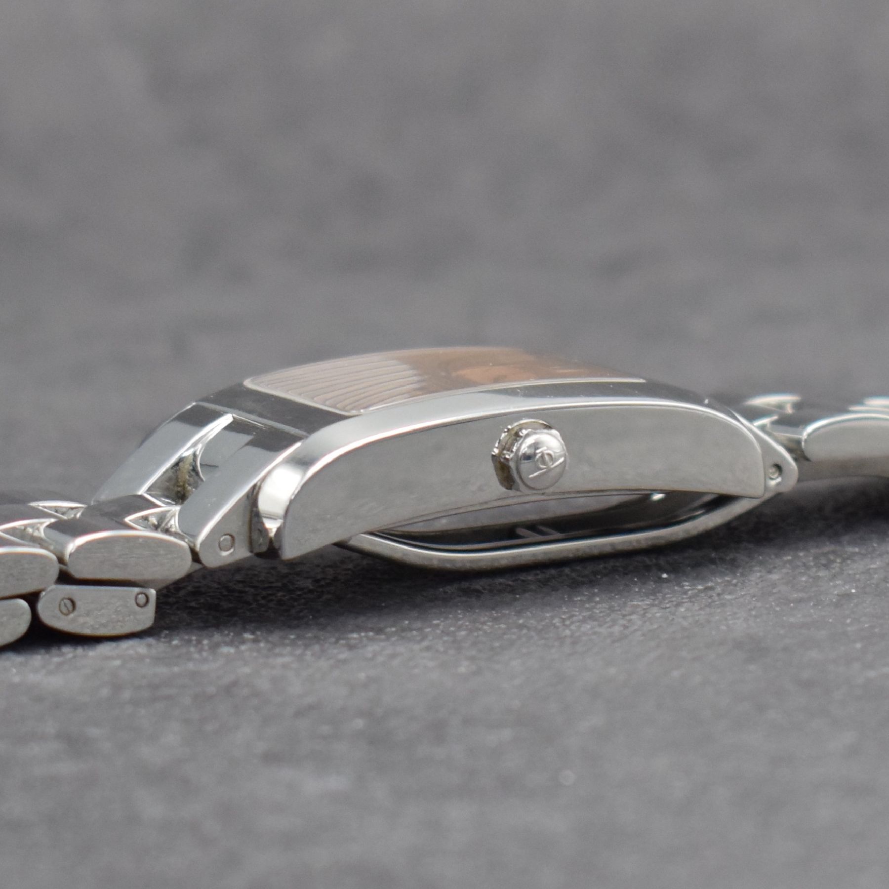 Detail e: BAUME MERCIER Hampton Armbanduhr in Edelstahl, Schweiz um 1996, Automatik, rechteckiges Geh., Boden aufgedr., Gliederband m. Faltschl., kupferfarb. ...