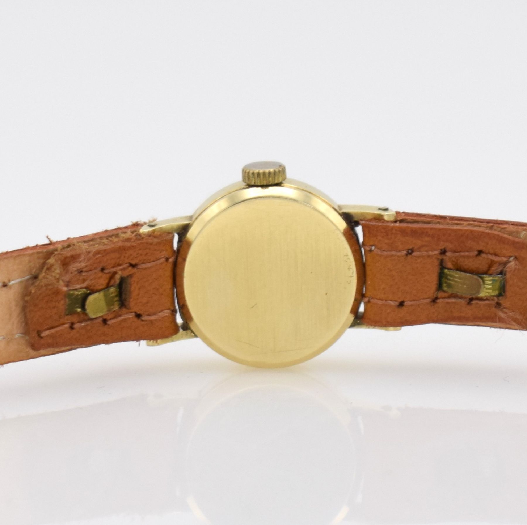 Detail d: IWC Damenarmbanduhr in GG 585/000, Schweiz um 1959, Handaufzug, Boden aufgedr., silb. Zifferbl. pat. m. aufgel. gold. Std.-Ind., gold. Zeiger, silb. ...
