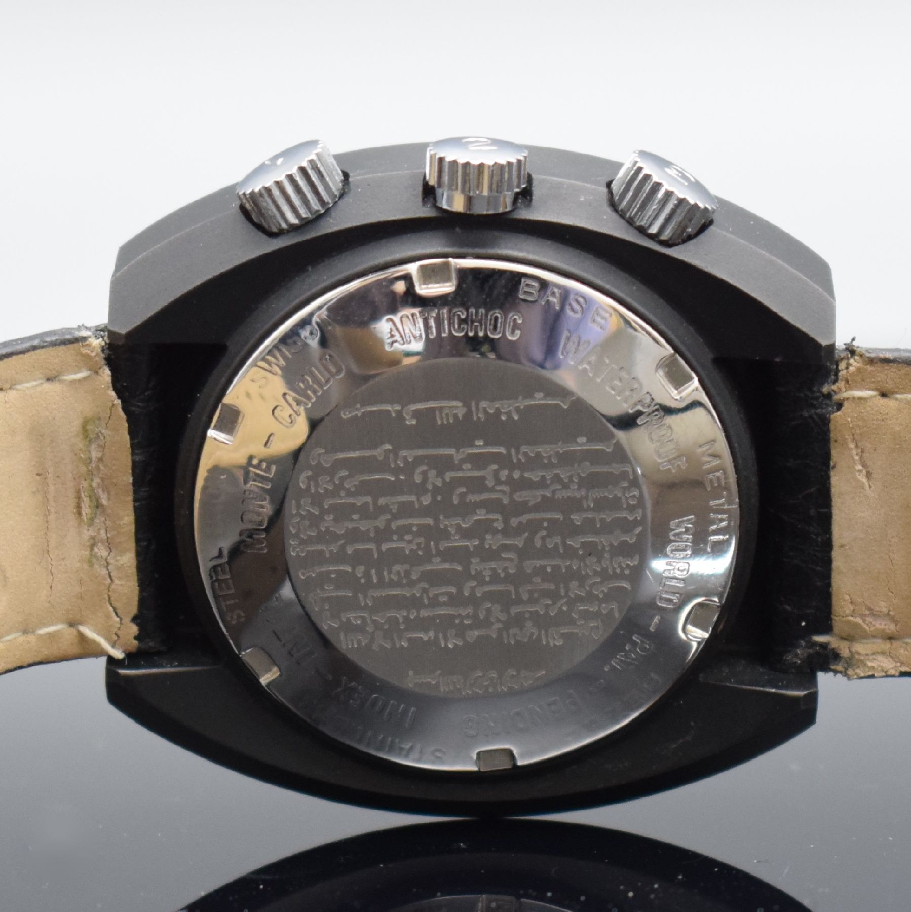 Detail e: DALIL sog. Moslems-Watch gut erhaltene Herrenarmbanduhr mit Kompass, Schweiz um 1975, Automatik, geschwärztes Gehäuse, Edelstahlboden geschr., ...