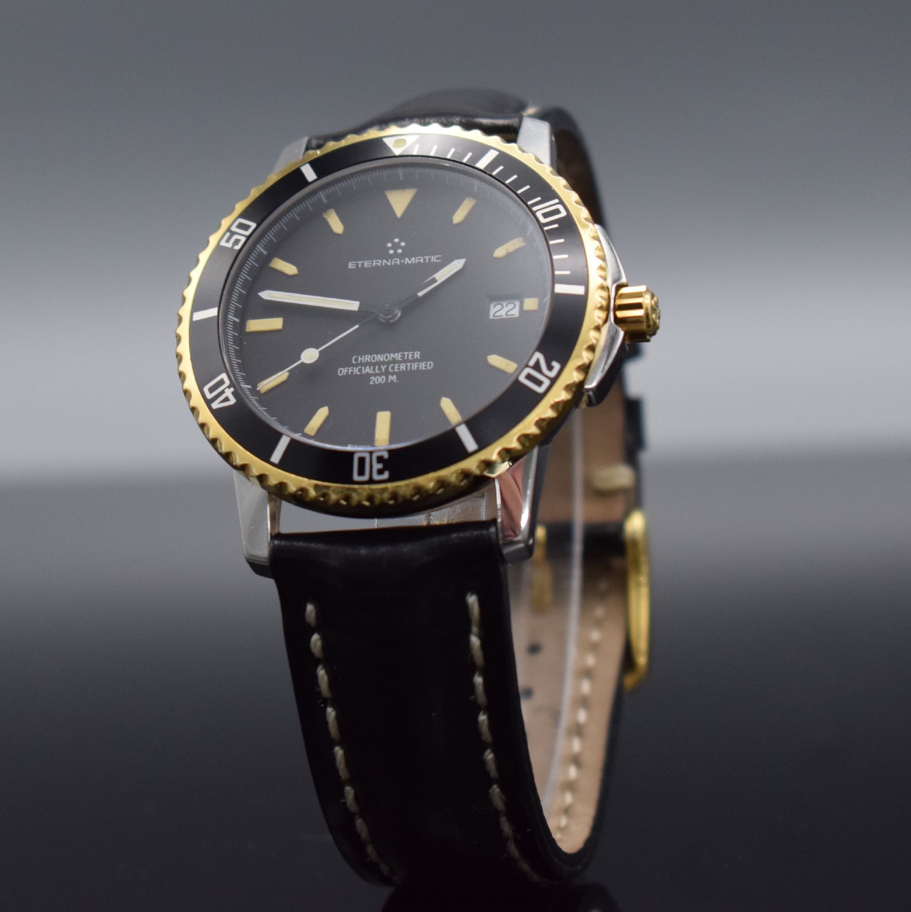 Detail b: ETERNA-MATIC Chronometer Herrenarmbanduhr, Schweiz um 1990, Automatik, Edelstahl/ Gold komb., eins. drehb. Lünette, geschr. Boden m. Widmung, ...