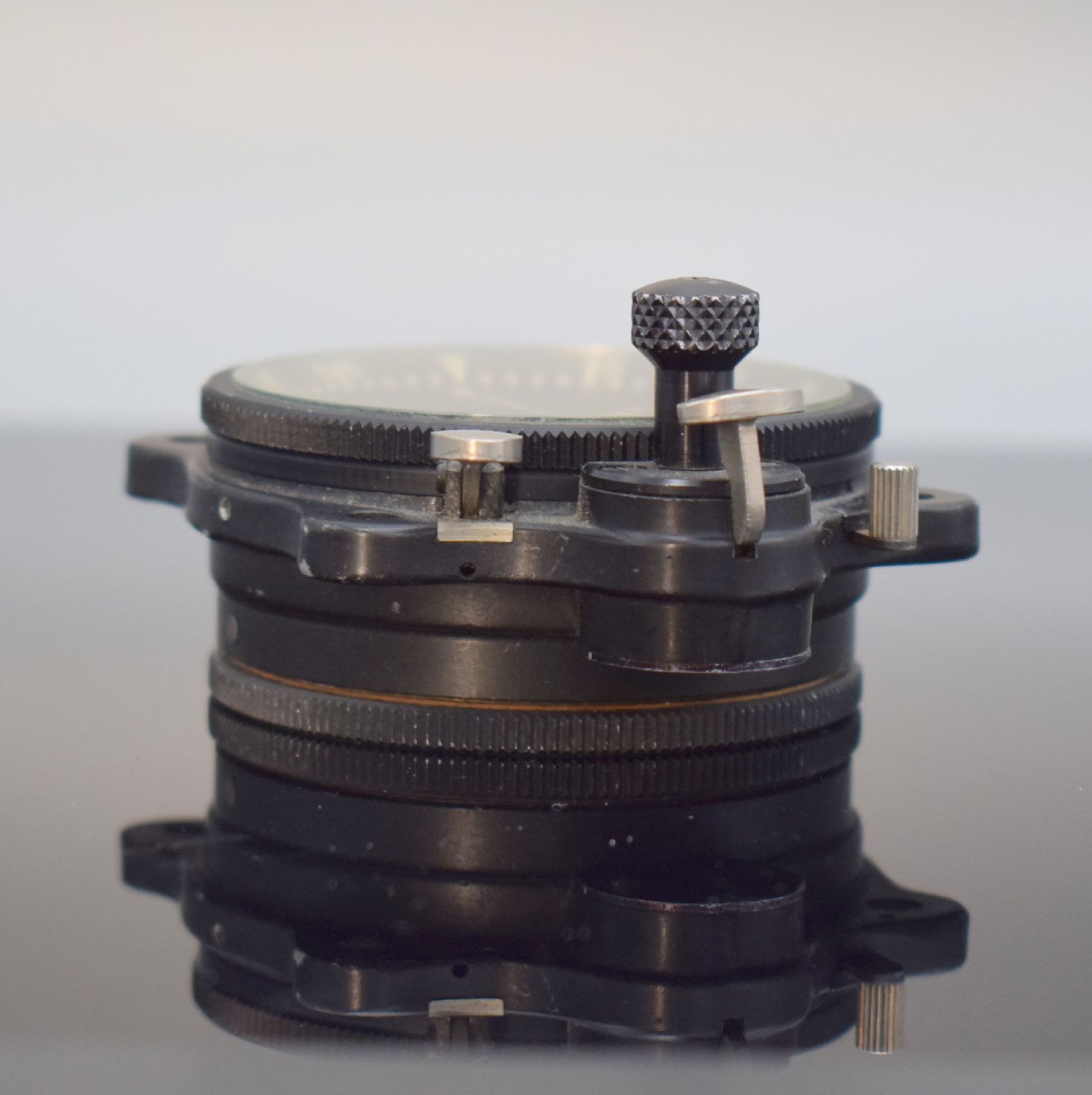 Detail d: MATHEY-TISSOT TYPE 12 seltene Borduhr mit Flyback-Chronograph Kal. Valjoux 555, Schweiz um 1960, geschwärztes Metallgehäuse, Boden m. ...