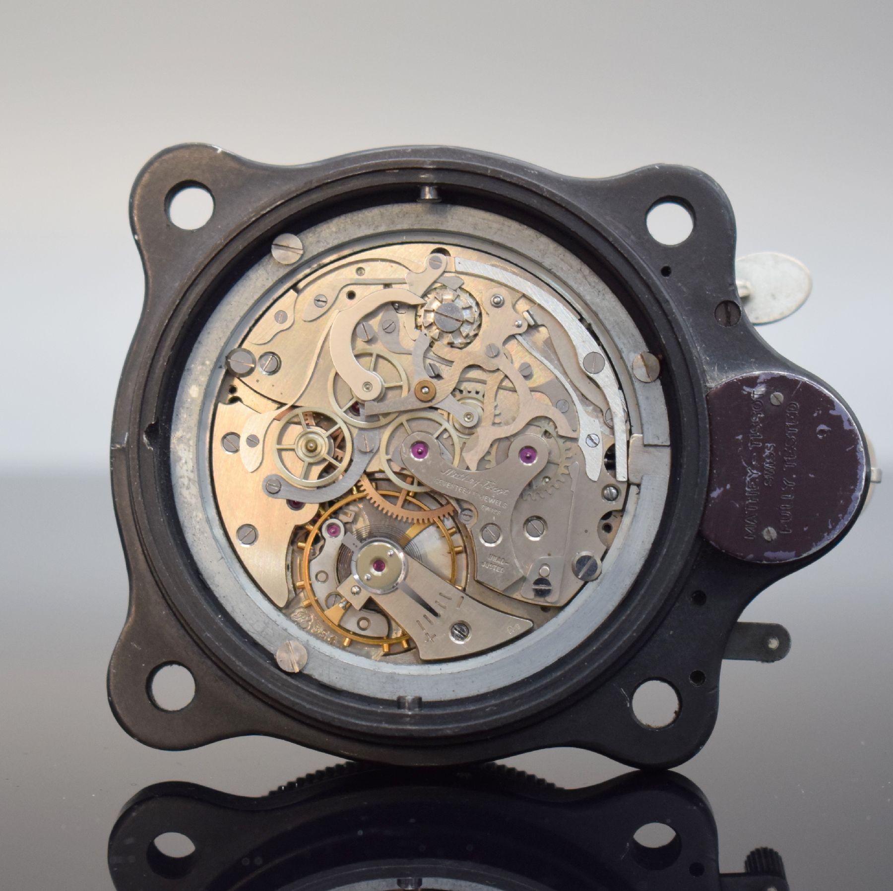 Detail h: MATHEY-TISSOT TYPE 12 seltene Borduhr mit Flyback-Chronograph Kal. Valjoux 555, Schweiz um 1960, geschwärztes Metallgehäuse, Boden m. ...