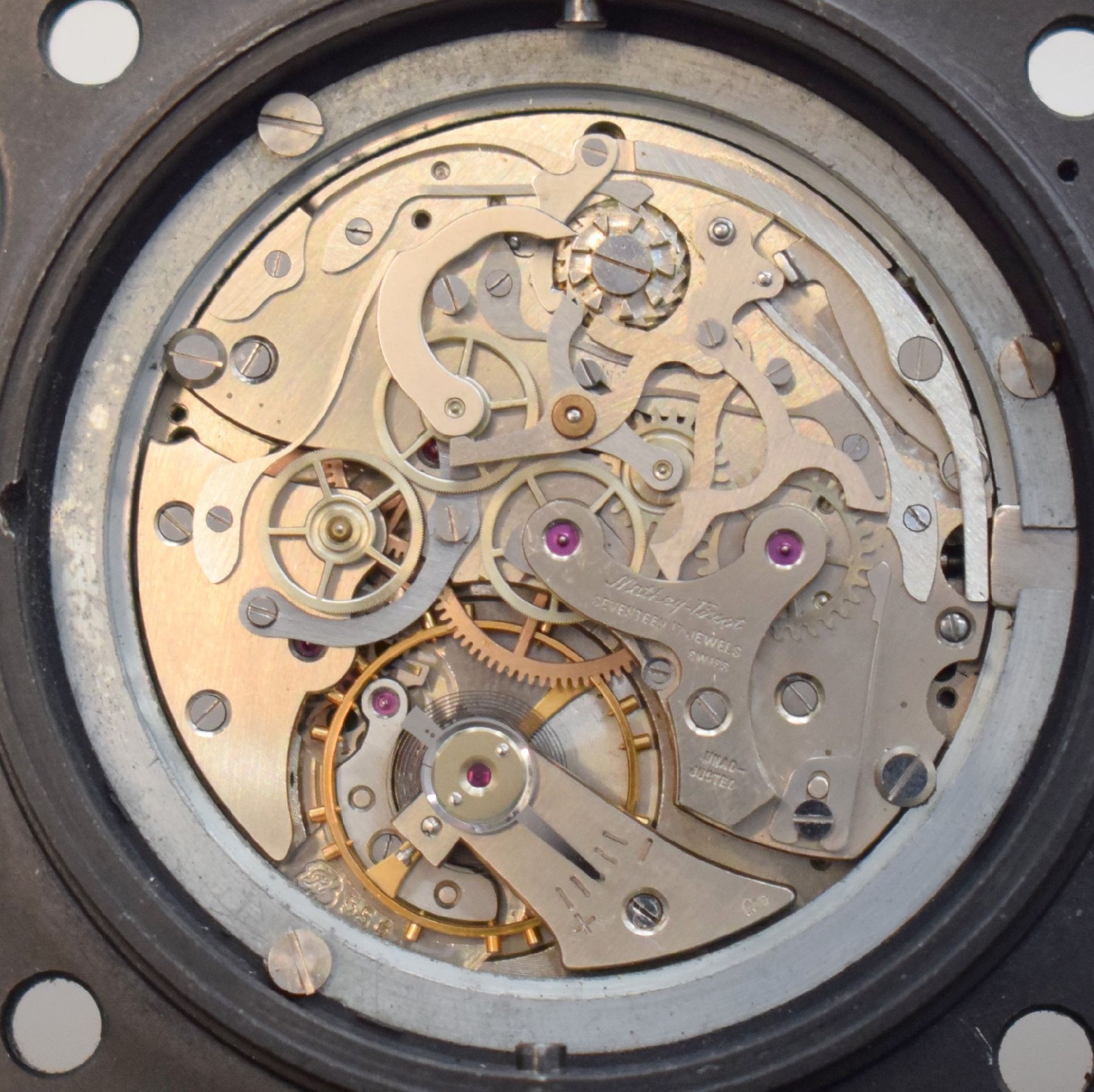 Detail i: MATHEY-TISSOT TYPE 12 seltene Borduhr mit Flyback-Chronograph Kal. Valjoux 555, Schweiz um 1960, geschwärztes Metallgehäuse, Boden m. ...
