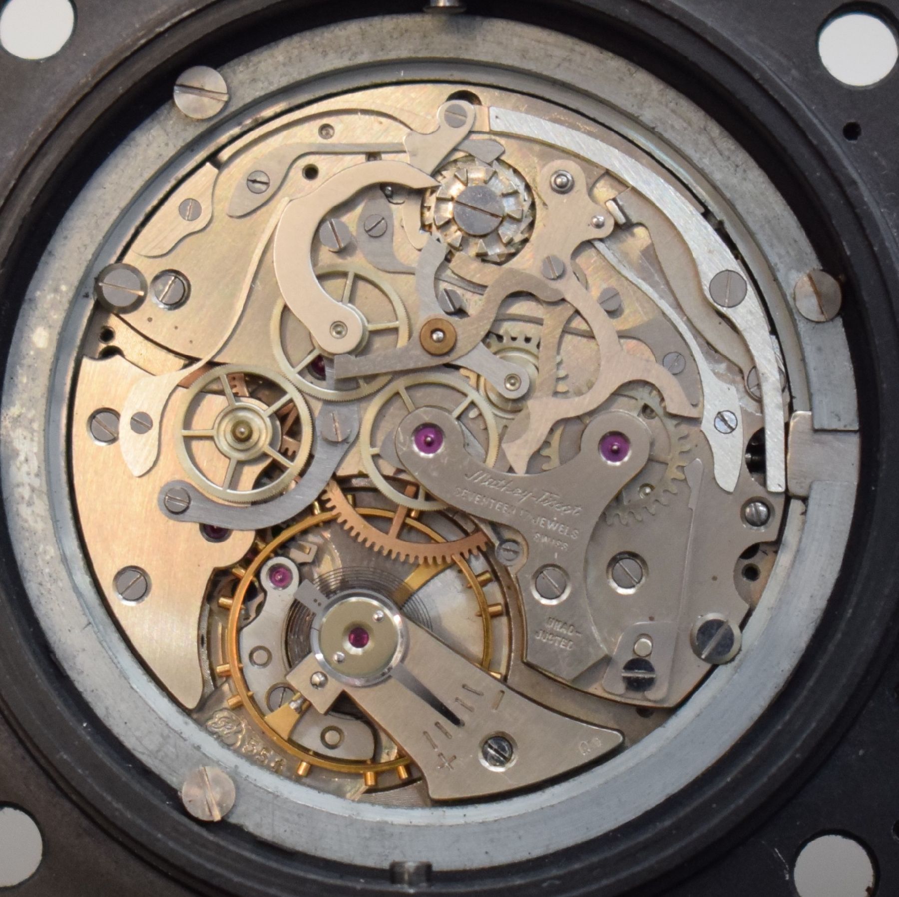 Detail j: MATHEY-TISSOT TYPE 12 seltene Borduhr mit Flyback-Chronograph Kal. Valjoux 555, Schweiz um 1960, geschwärztes Metallgehäuse, Boden m. ...