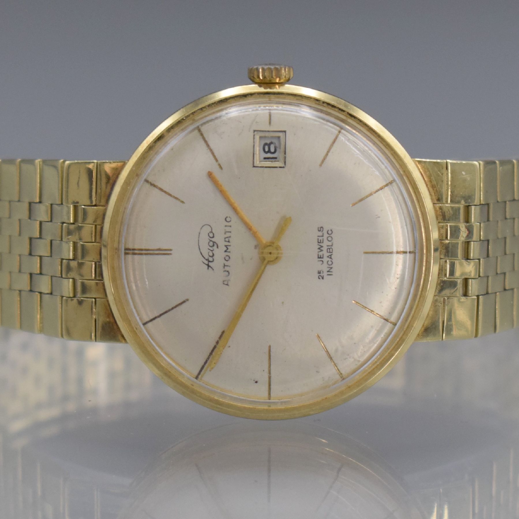 Detail a: HAGO Herrenarmbanduhr in GG 585/000, Deutschland/Schweiz um 1960, Automatik, aufgedr. Boden dell., anges. Goldband, silb. Zifferbl., gold. Zeiger, ...