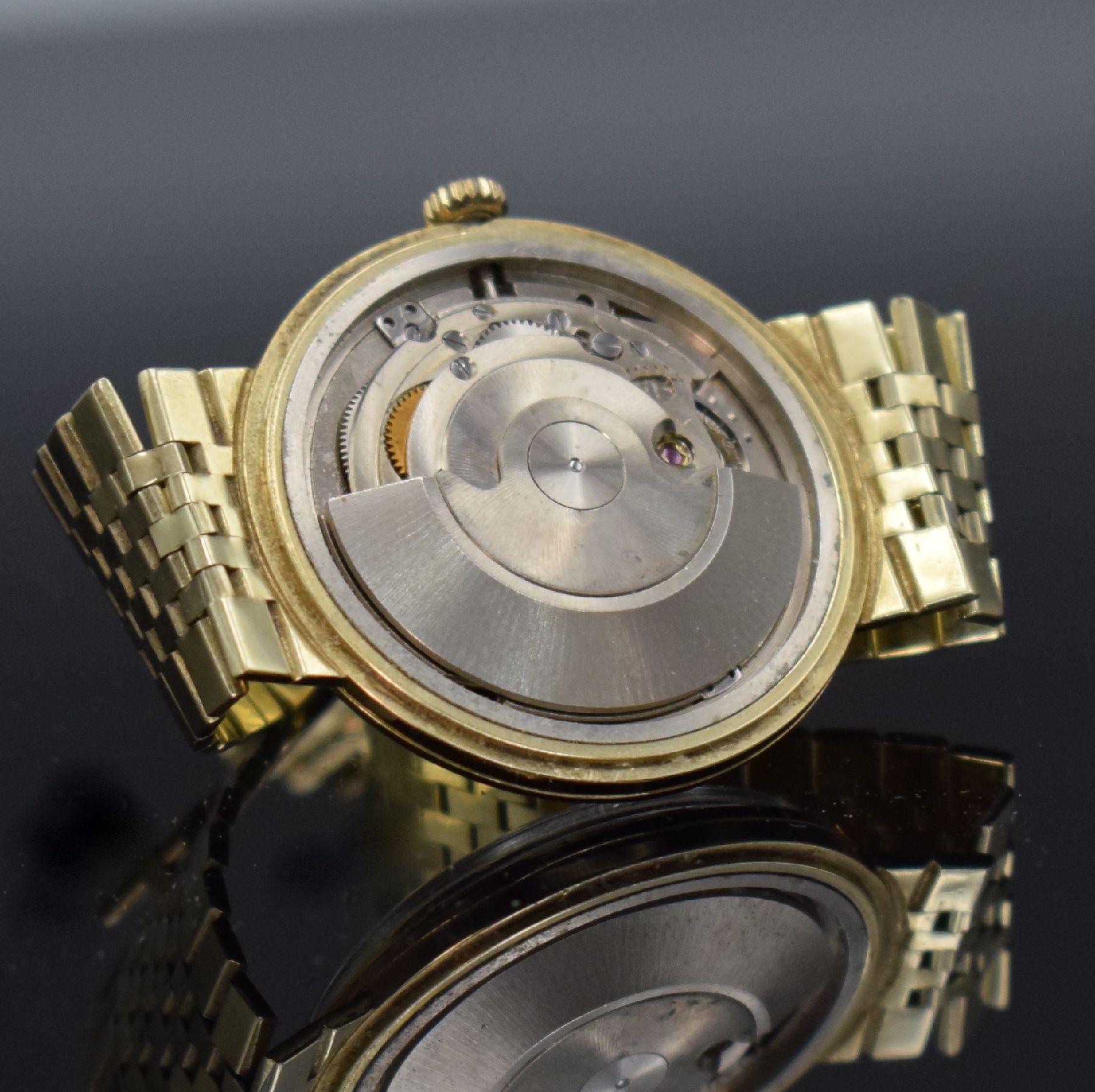 Detail i: HAGO Herrenarmbanduhr in GG 585/000, Deutschland/Schweiz um 1960, Automatik, aufgedr. Boden dell., anges. Goldband, silb. Zifferbl., gold. Zeiger, ...