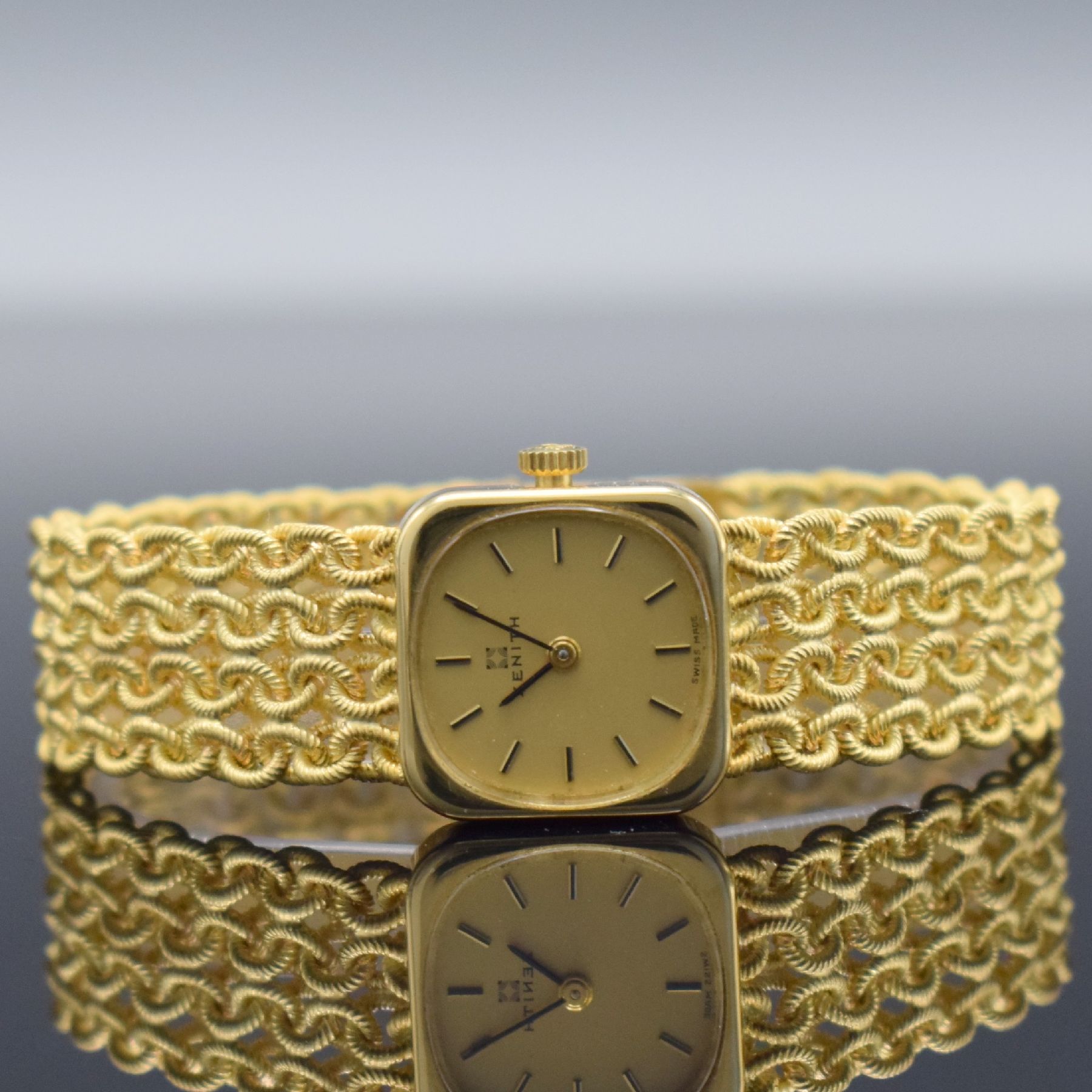 ZENITH Damengoldbanduhr in GG 750/000, Schweiz um 1980, Handaufzug, quadrat. Geh., Boden aufgedr., aufw., anges. Band aus grav. Ösen, gold. ...