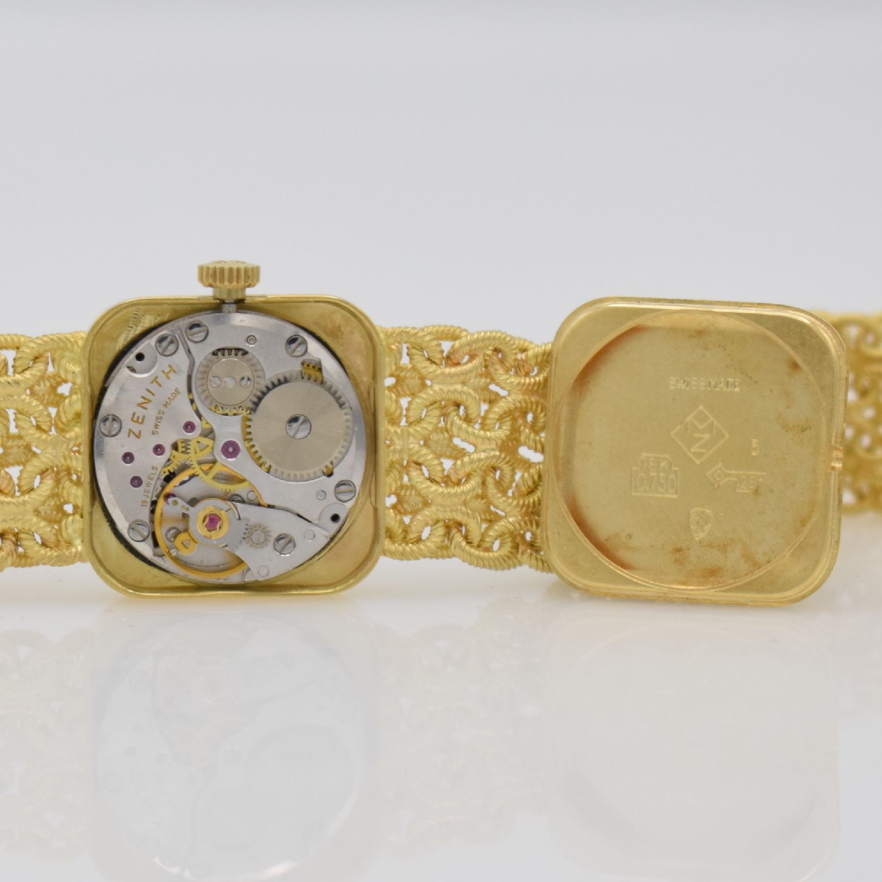 Detail l: ZENITH Damengoldbanduhr in GG 750/000, Schweiz um 1980, Handaufzug, quadrat. Geh., Boden aufgedr., aufw., anges. Band aus grav. Ösen, gold. ...