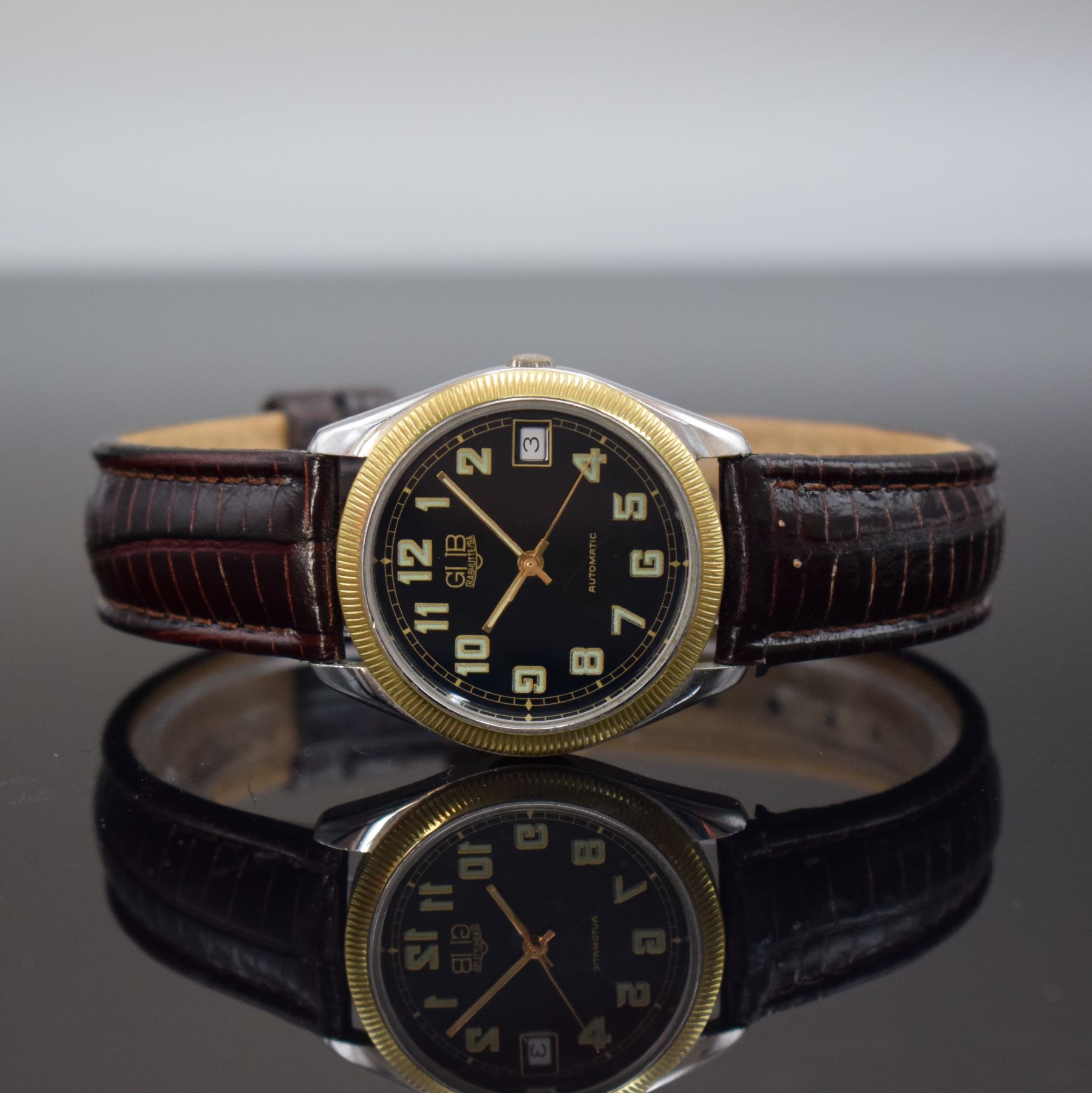 GUB Herrenarmbanduhr, Deutschland/Schweiz um 1993, Automatik, verchr. Metallgeh. beids. vergl., Verchromung teilw. besch., geriffelte Lünette verg., ...