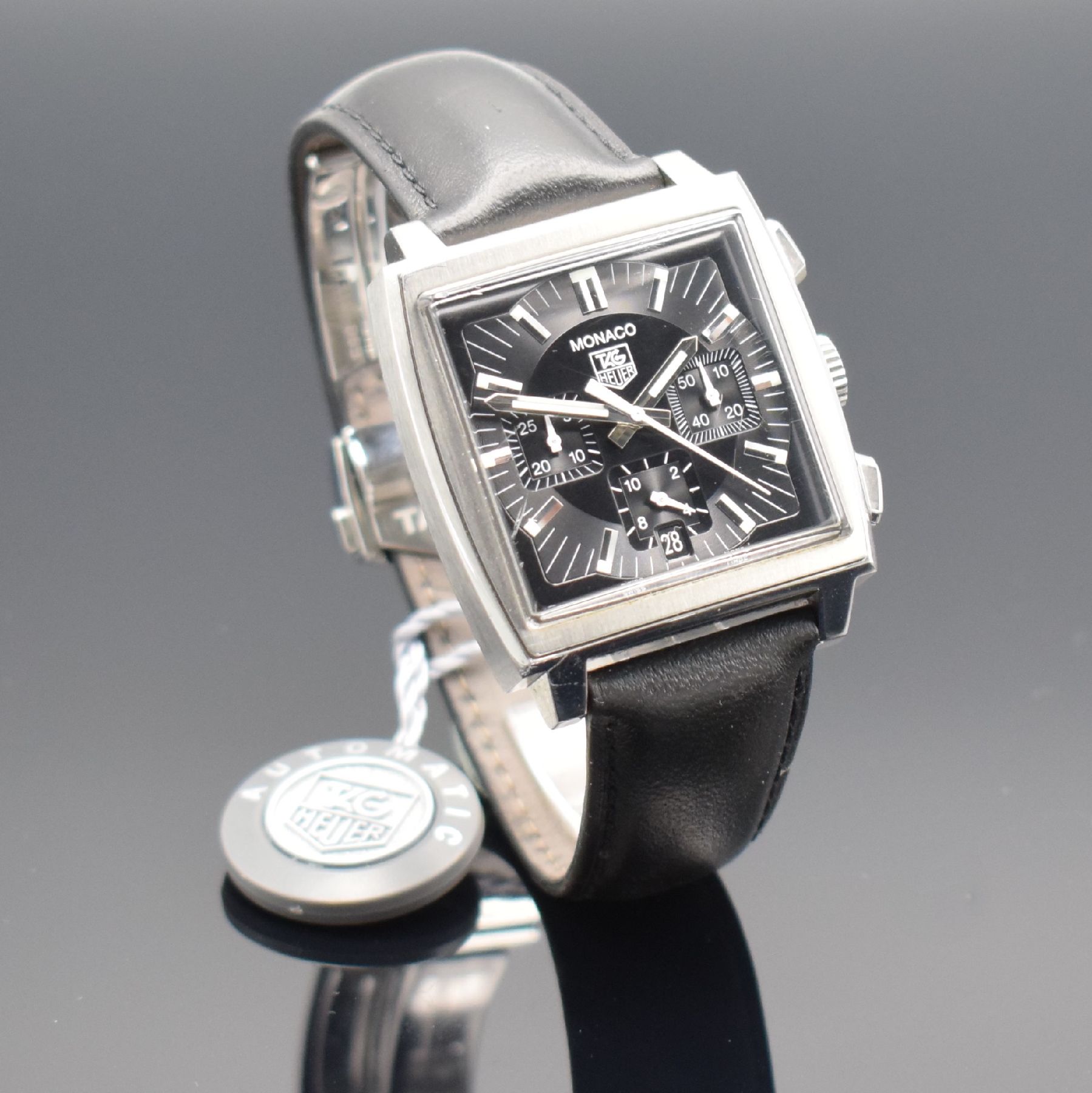 Detail d: TAG HEUER MONACO Herrenarmbanduhr mit Chronograph Ref. CW2111-0, Schweiz um 2005, Automatik, Edelstahlgeh., Boden 4-fach verschr., orig. Lederband m. ...