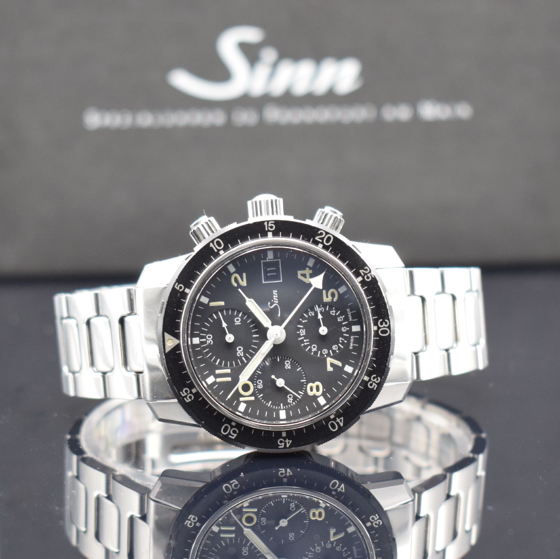 SINN 103 Herrenarmbanduhr mit Chronograph, Schweiz/Deutschland um 1990, beids. vergl. & verschr. Edelstahlgeh., orig. Gliederband m. Faltschl., ...