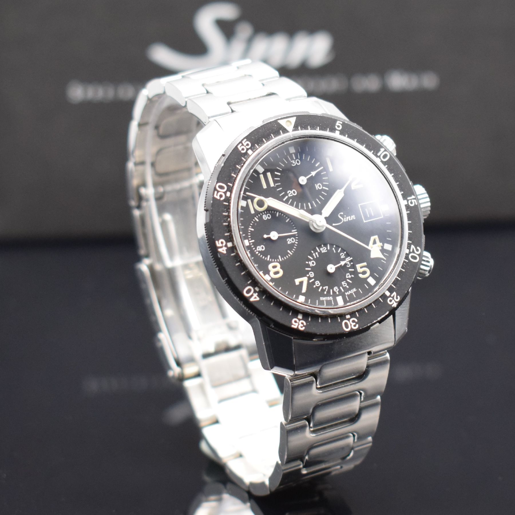 Detail d: SINN 103 Herrenarmbanduhr mit Chronograph, Schweiz/Deutschland um 1990, beids. vergl. & verschr. Edelstahlgeh., orig. Gliederband m. Faltschl., ...