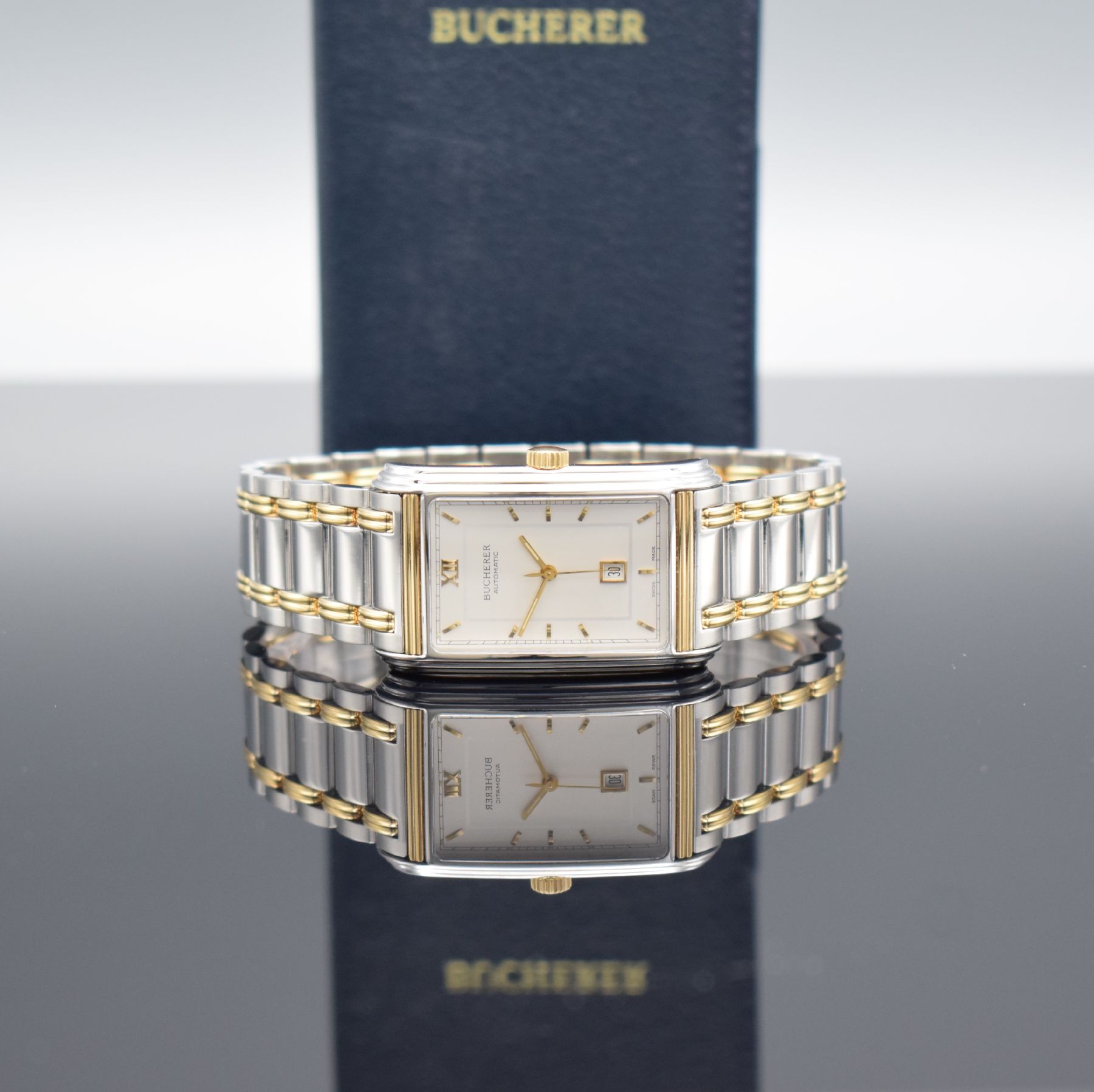 Detail a: BUCHERER rechteckige Herrenarmbanduhr Modell Archimedes in Stahl/Gold, Schweiz verk. lt. beil. Pap. 03/1996, Automatik, Ref. 2000-503, Boden 4-fach ...